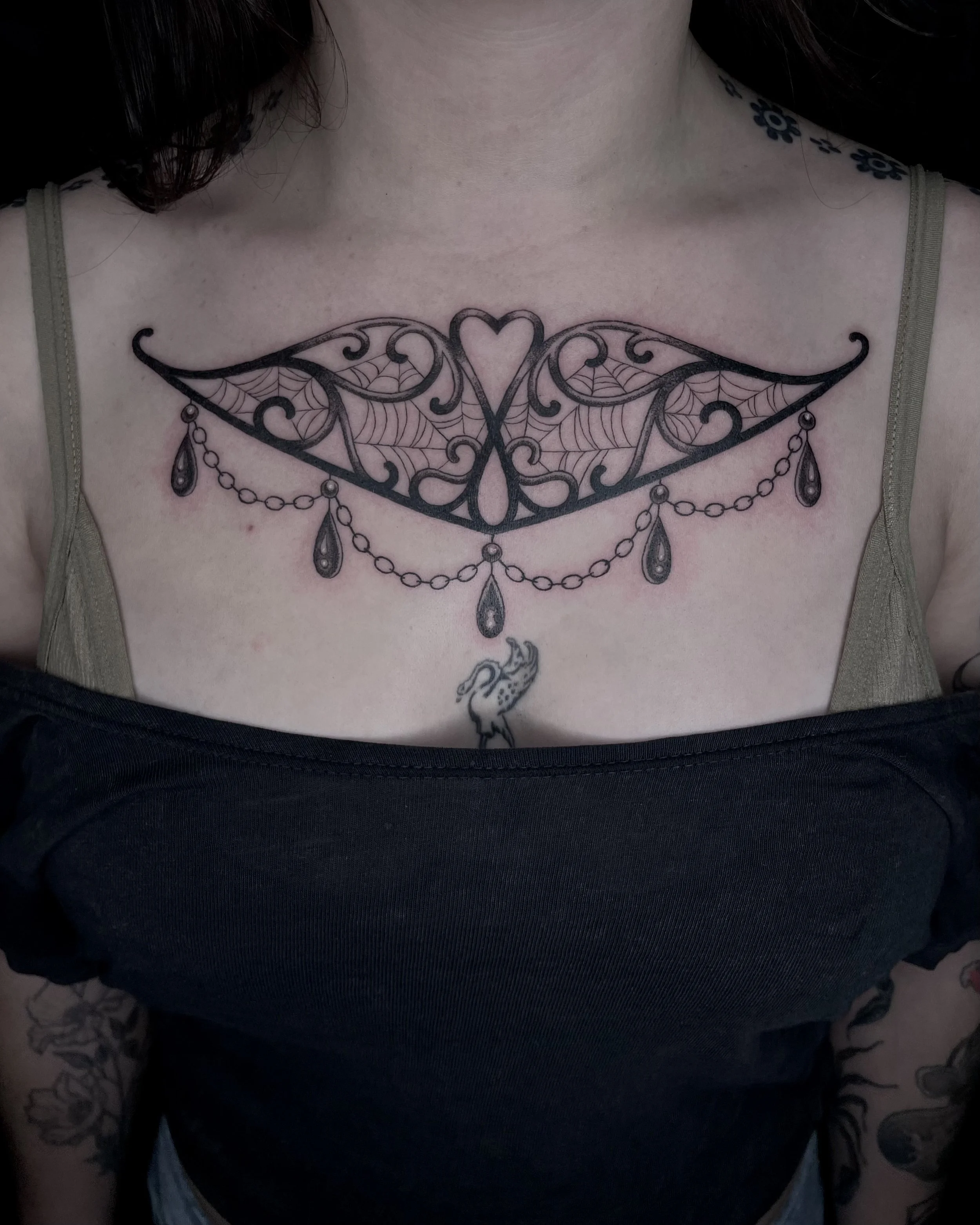 ornamental gothic metalwork chest tattoo