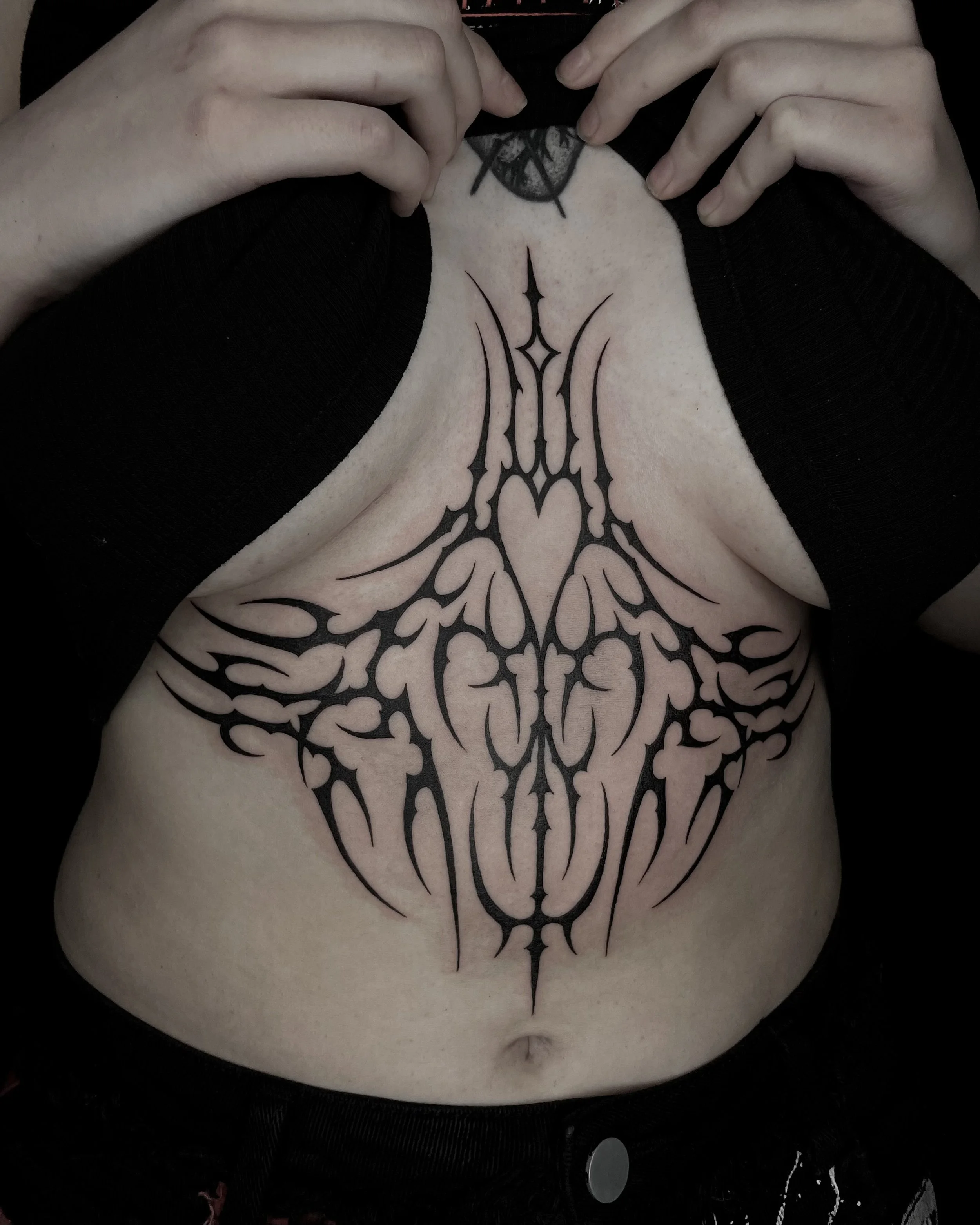 neo tribal sternum tattoo