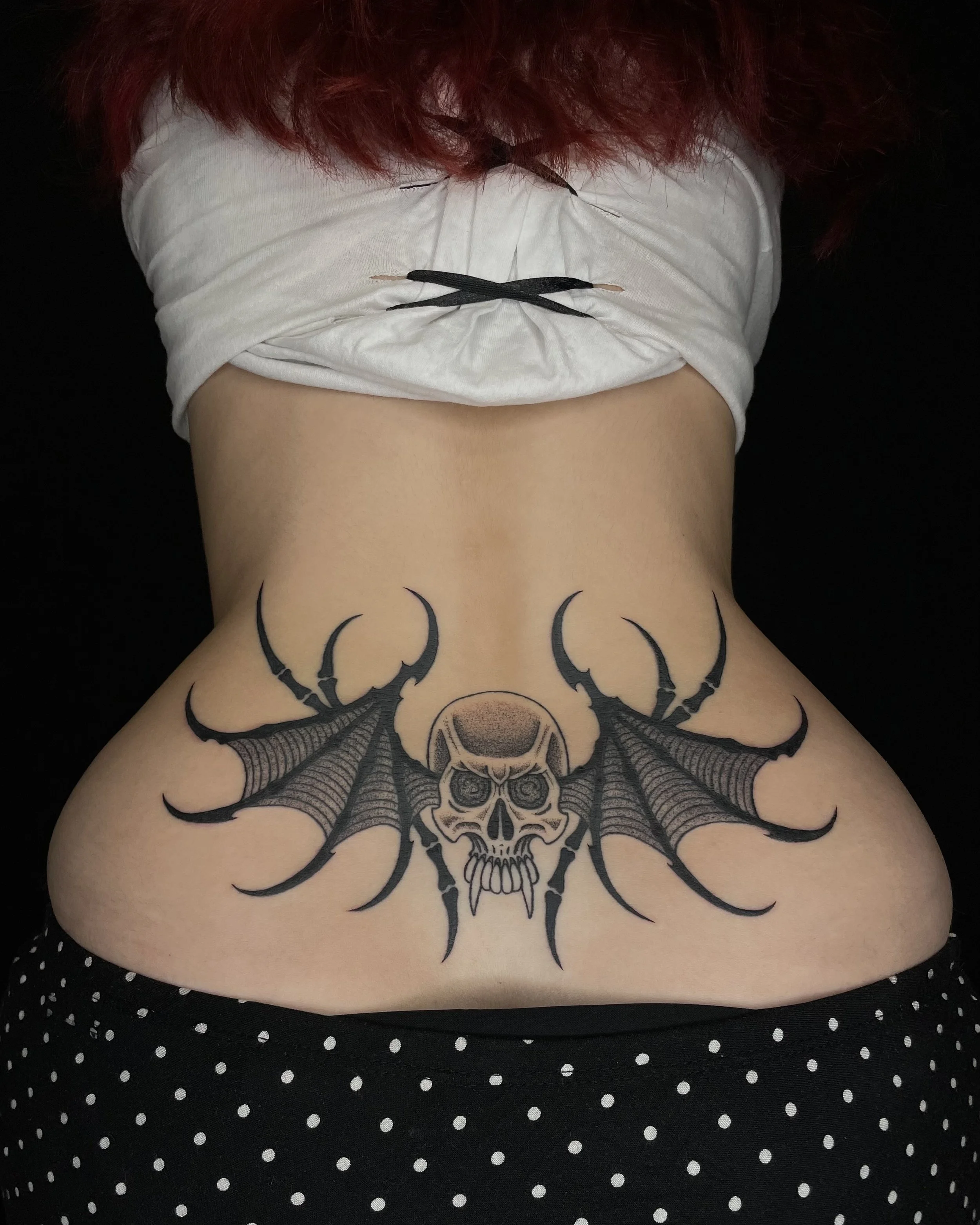 skull with bat wings tattoo