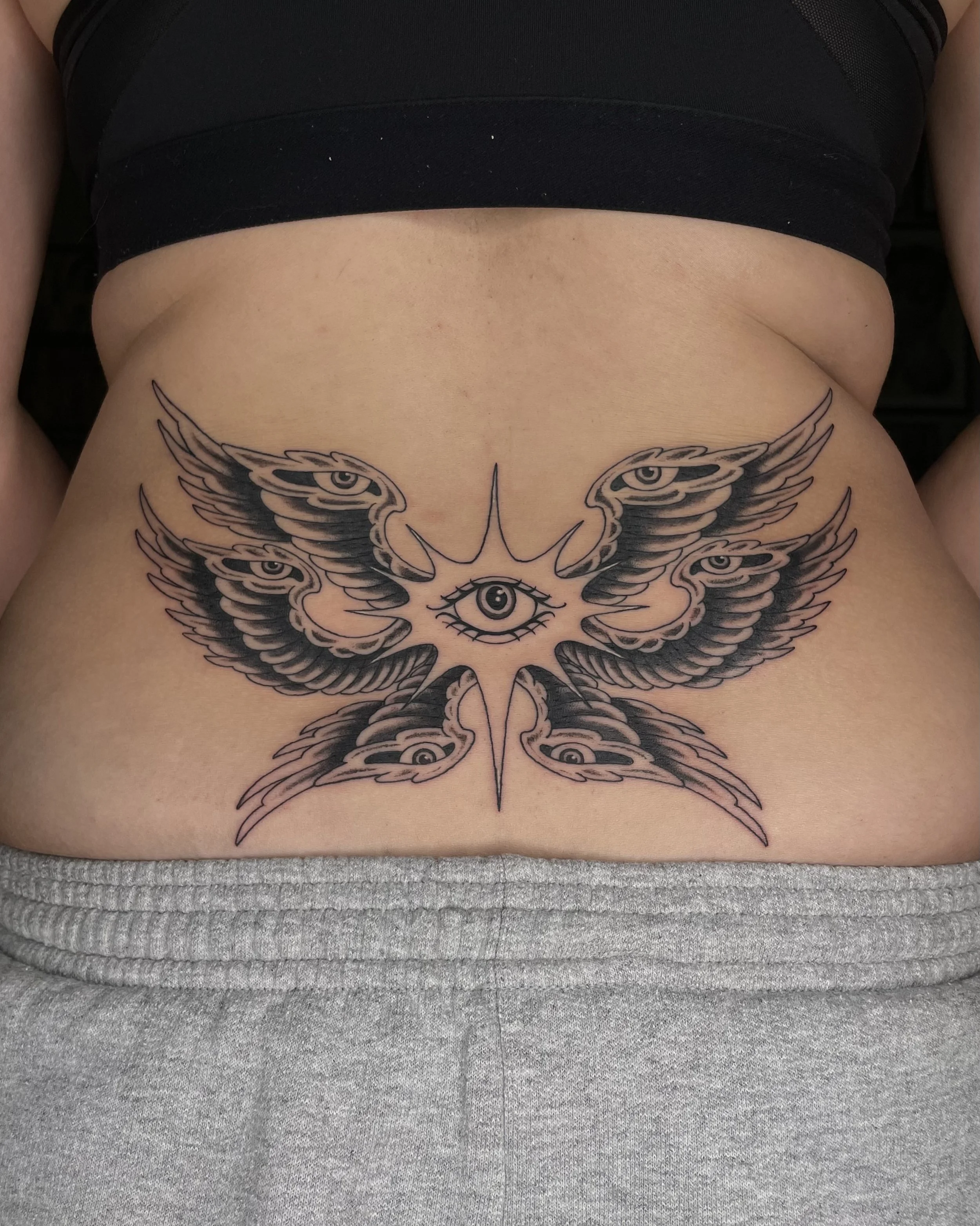 seraphim lower back tattoo