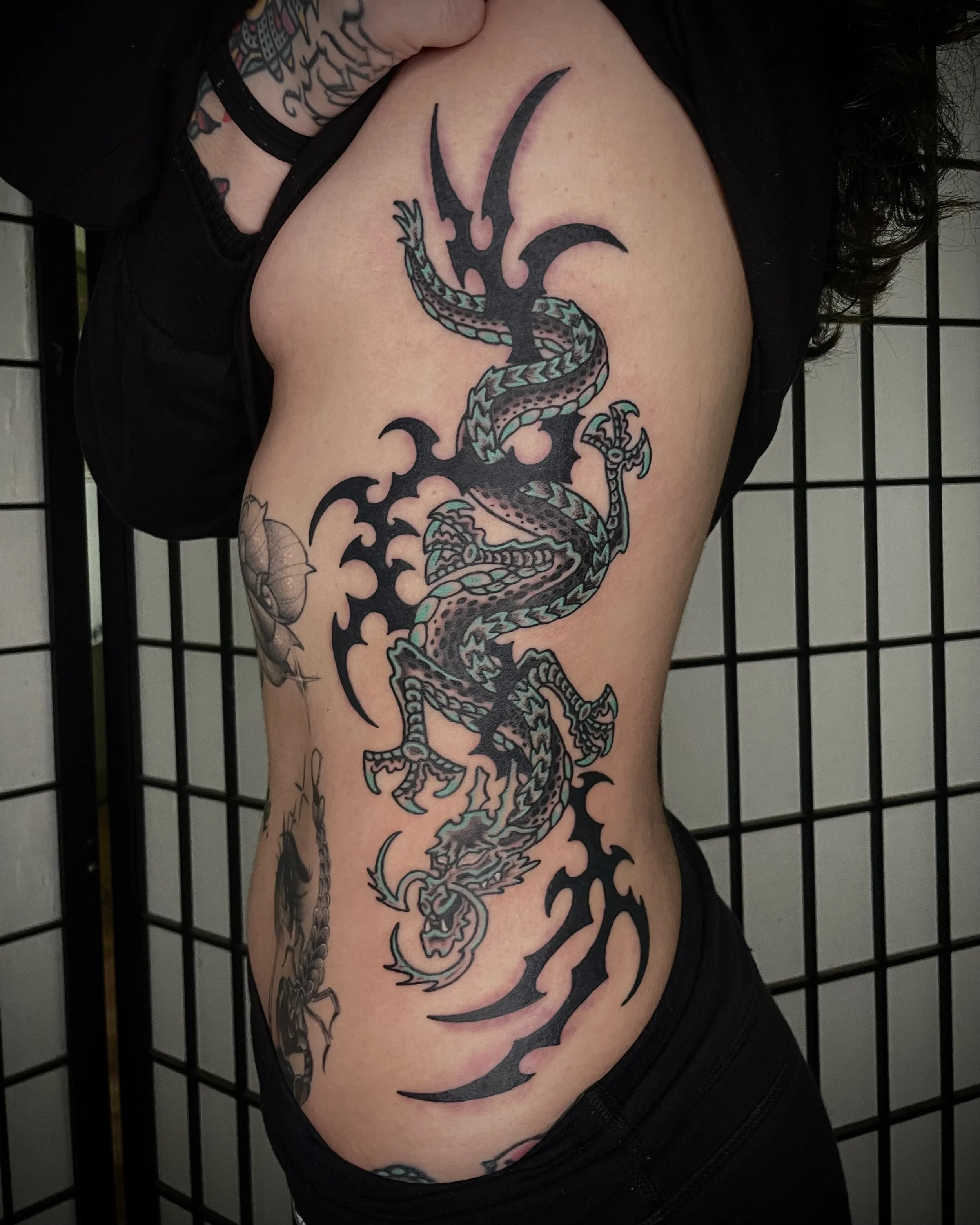 Japanese dragon with tribal tattoo