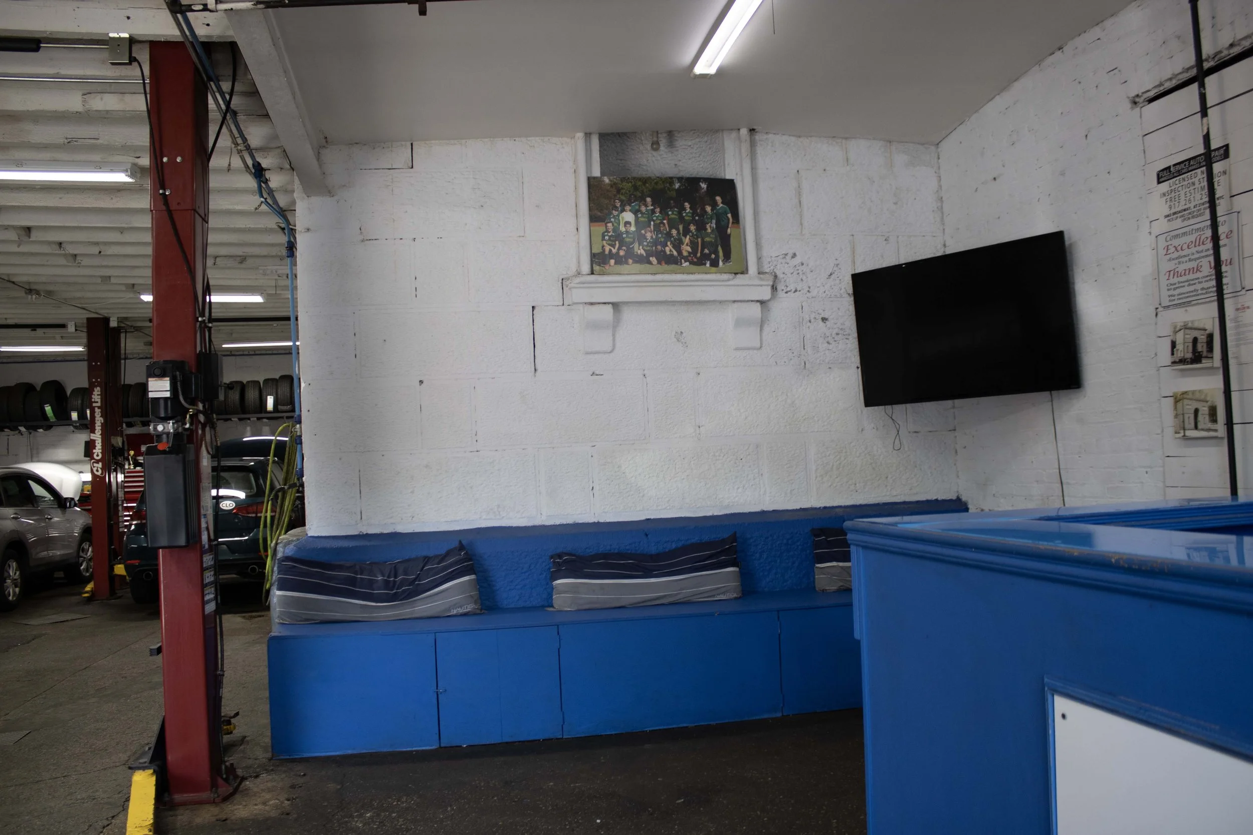 Interior of the autobody shop that is built around the left column of the arch.