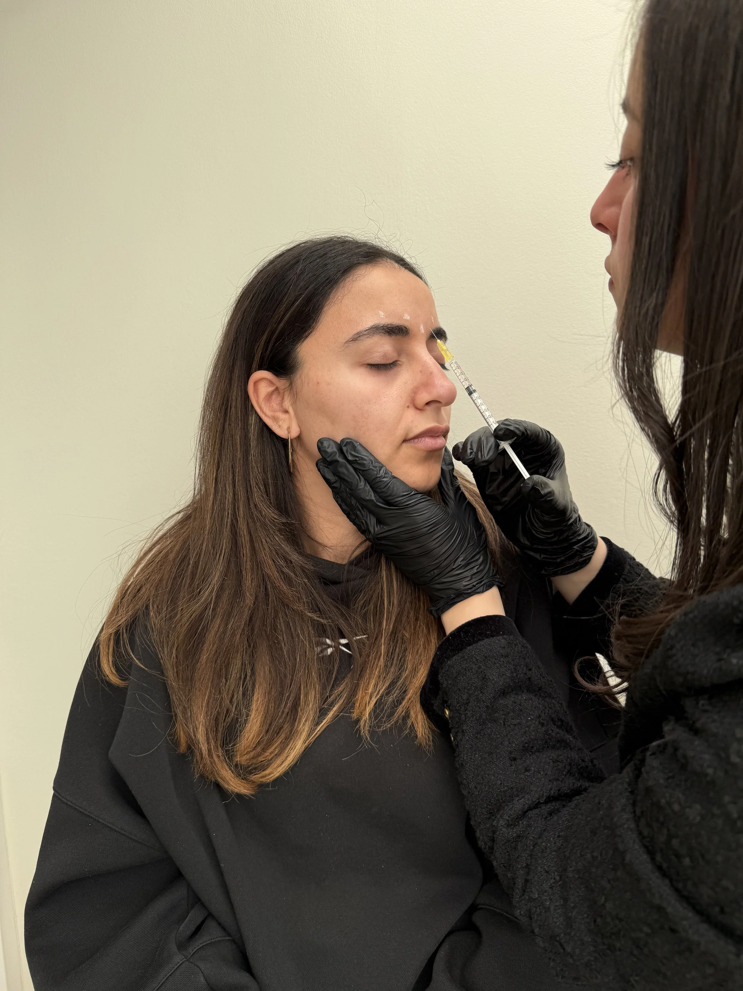 Dr Lamy performing botox injections