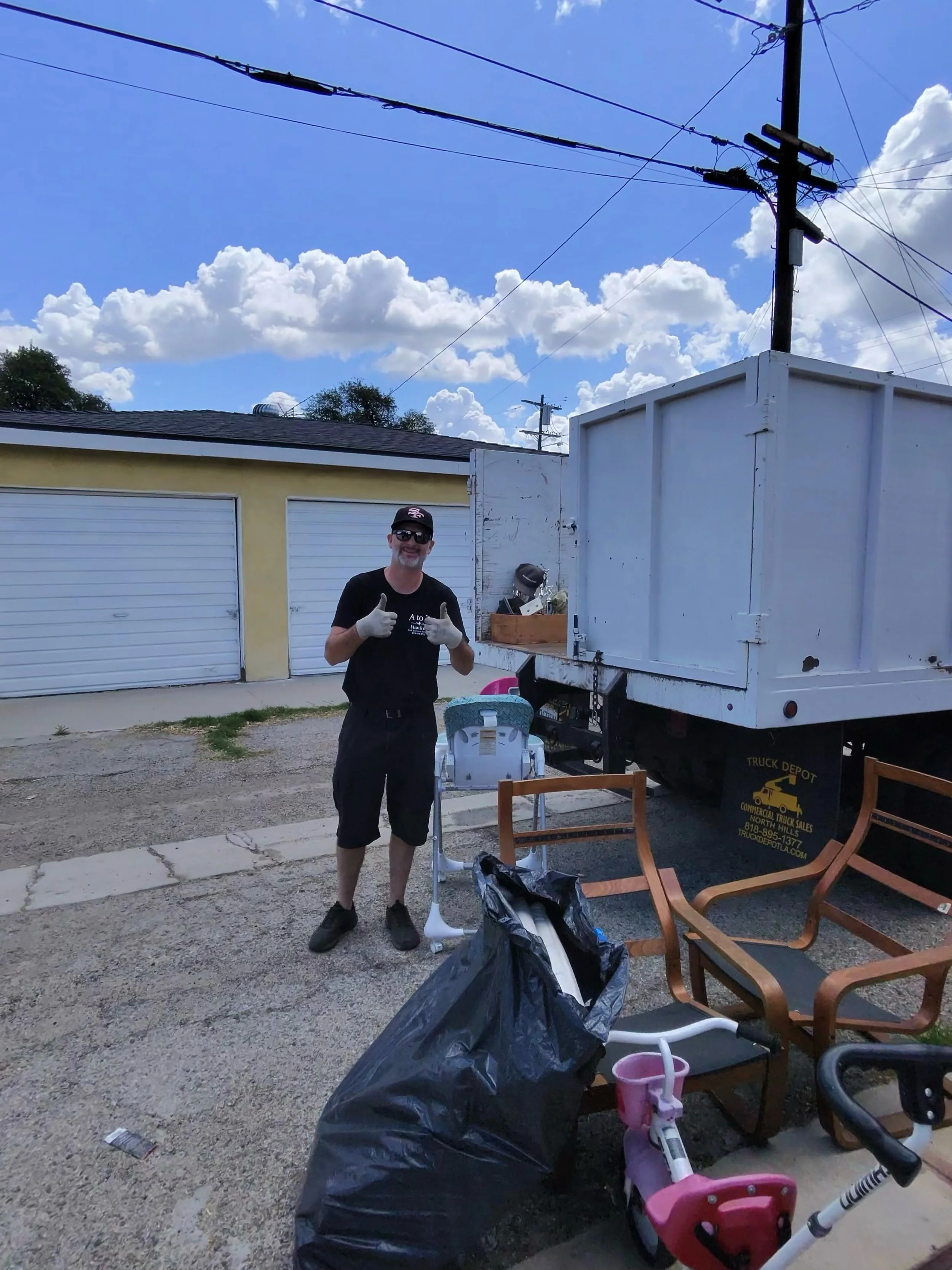 A to Z hauling Junk Removal crew member removing general junk