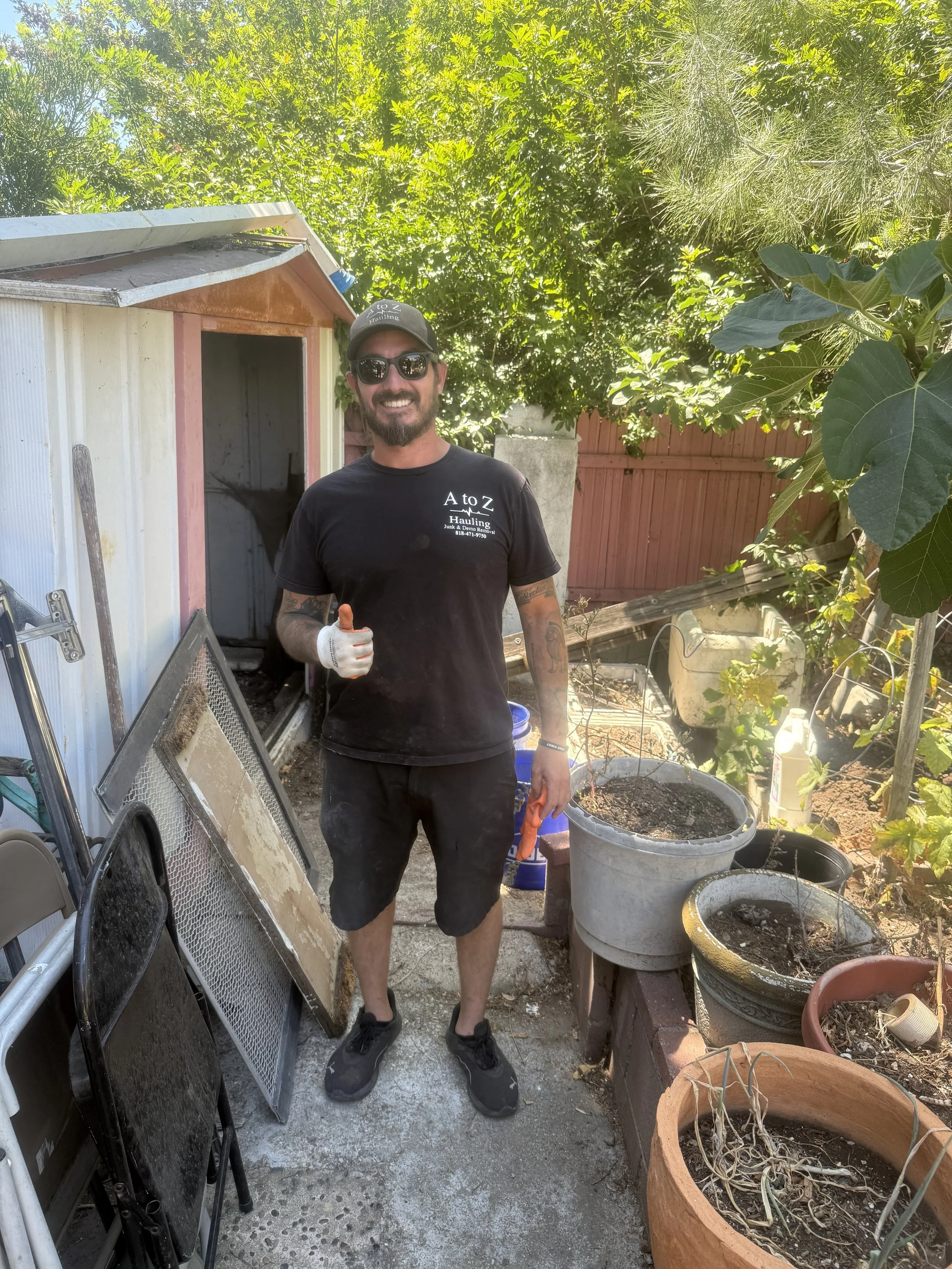 A to Z Hauling crew member before picture of a shed removal