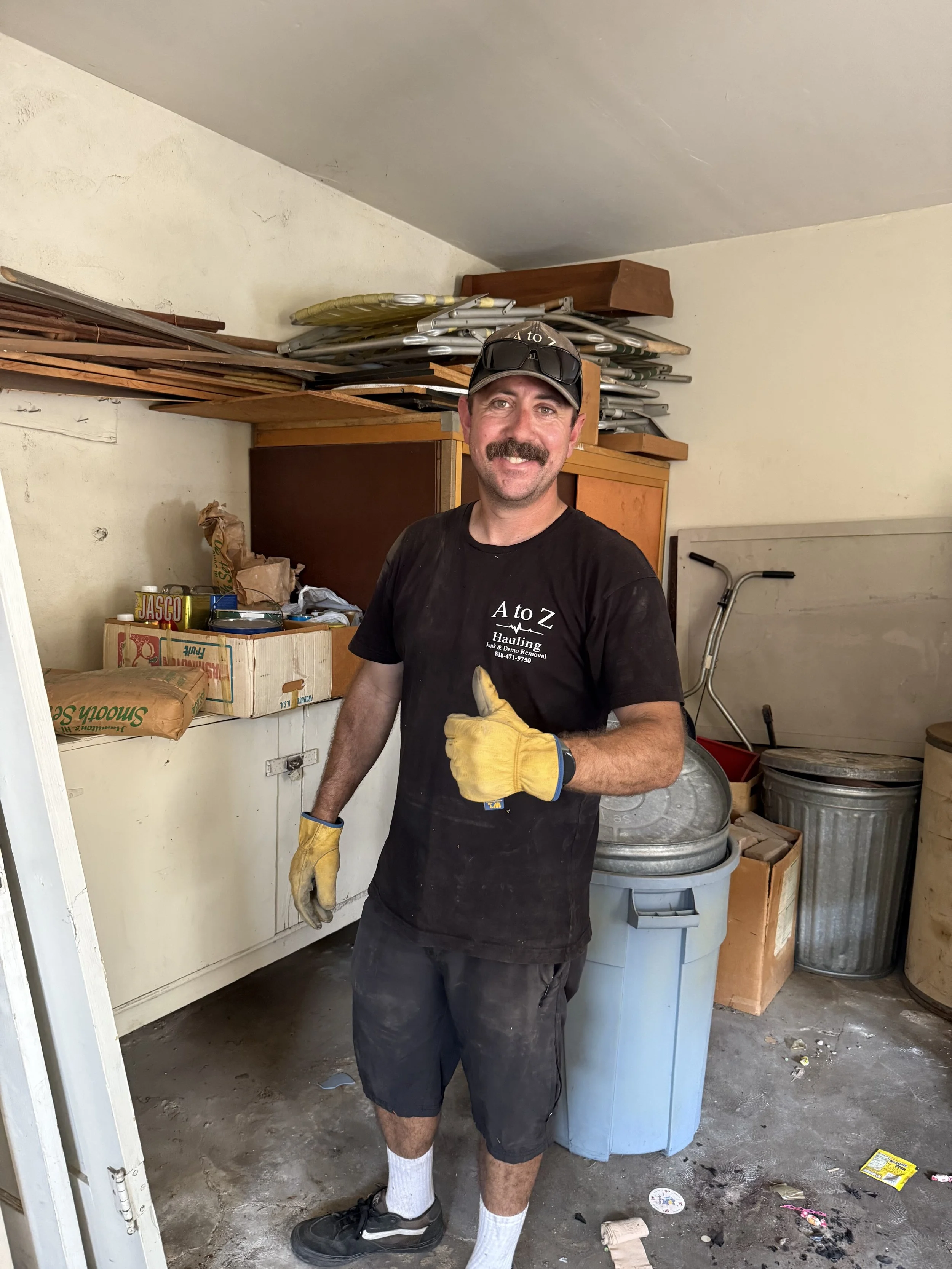 A to Z crew member in the process of a garage cleanout in Burbank Ca