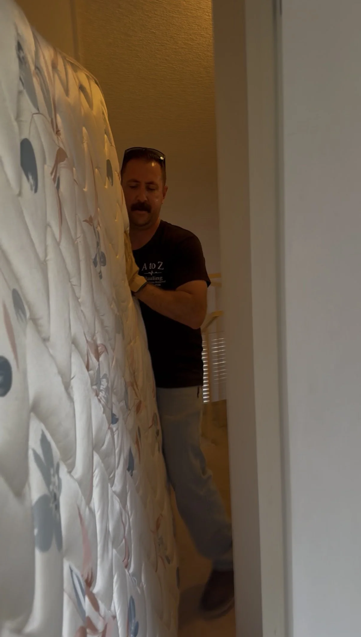 A to Z hauling junk removal crew member removing old mattress in burbank ca