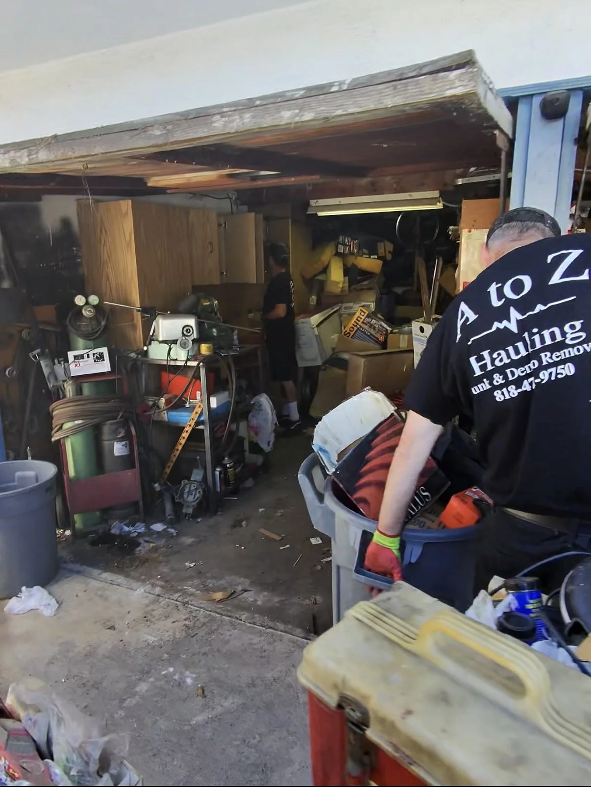 A to Z crew members doing a garage cleanout in burbank Ca