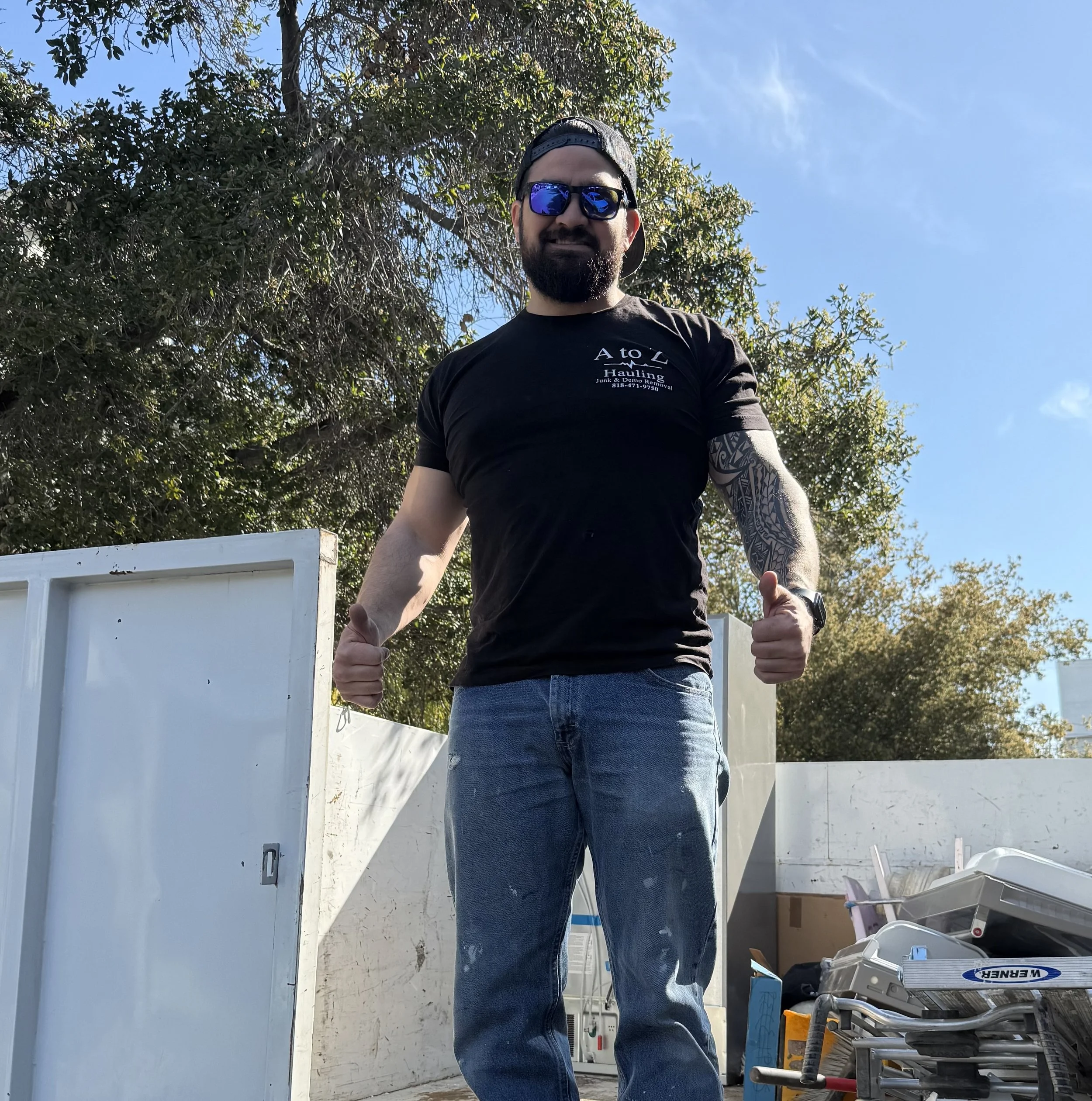 A to Z Hauling team member standing by the truck during a junk removal job in Burbank, CA