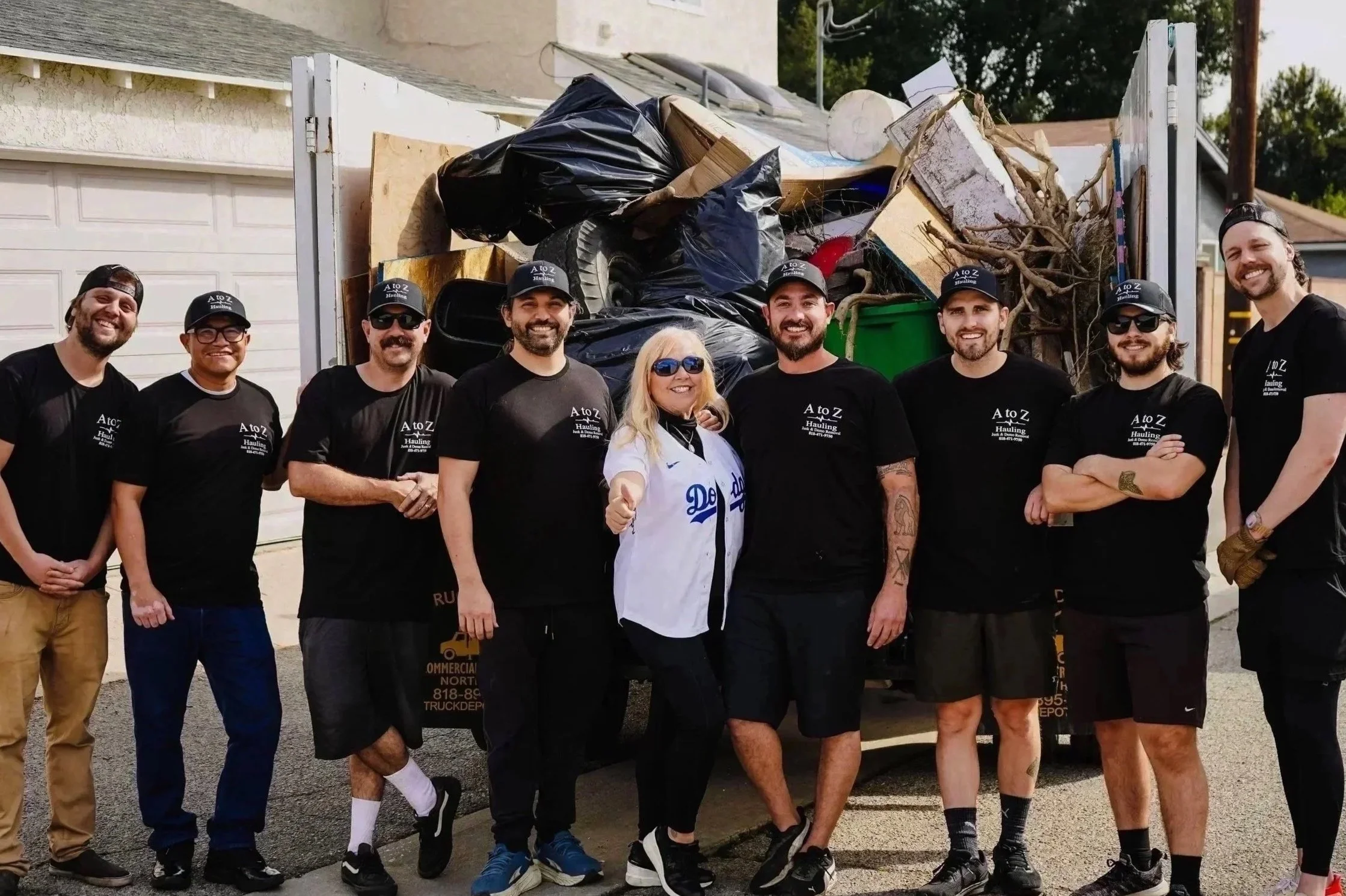 A to Z Hauling Crew in front of the truck in the process of a property cleanout in burbank ,CA