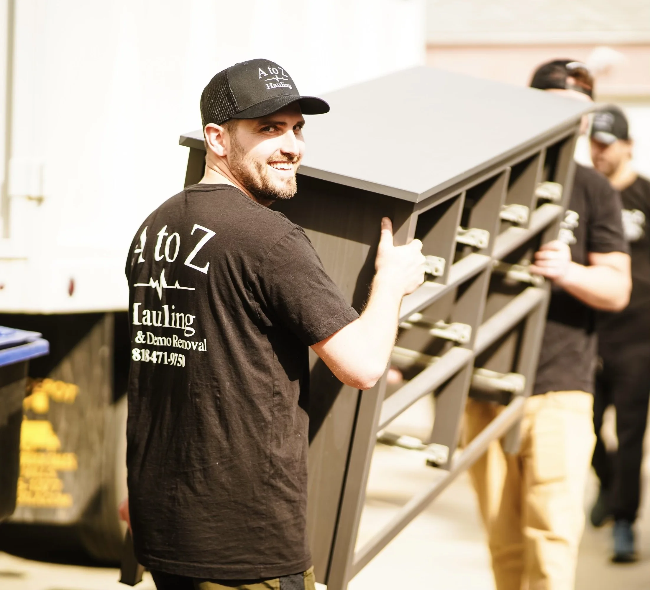 A to Z Hauling crew member removing an old dresser during an apartment cleanout in Burbank, CA
