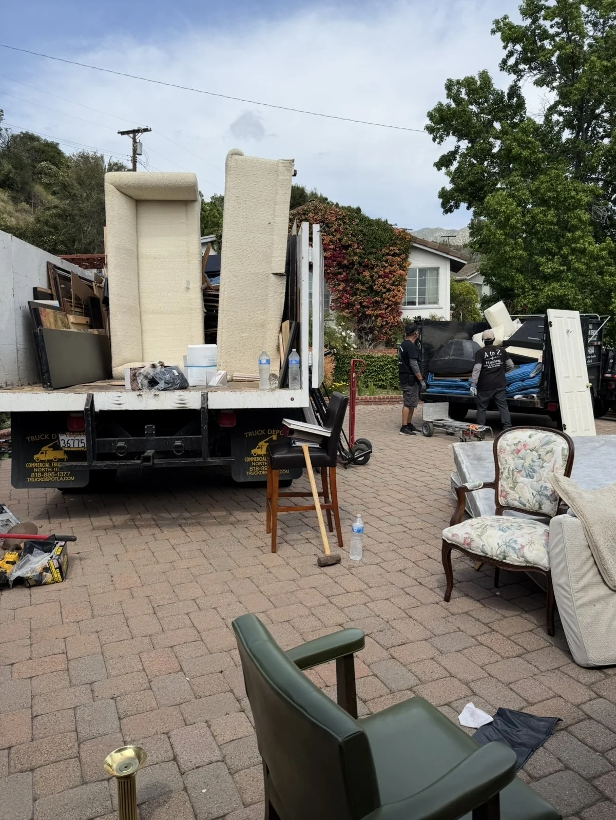 A to Z Hauling Junk Removal in the process of a junk removal pickup in Burbank Ca
