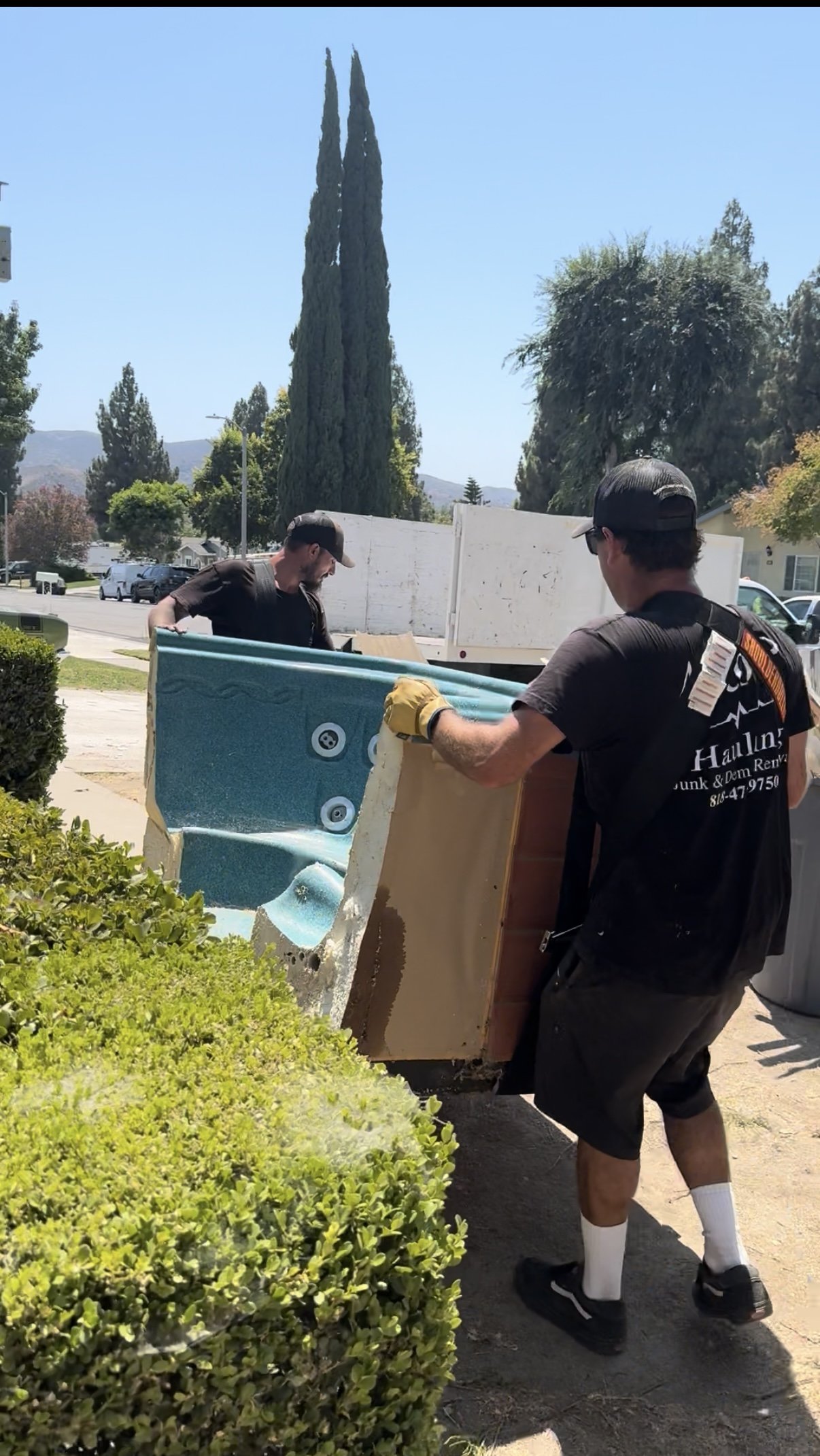 A to Z Hauling Junk removal crew handling all the heavy lifting! removing a jacuzzi in Chatsworth Ca