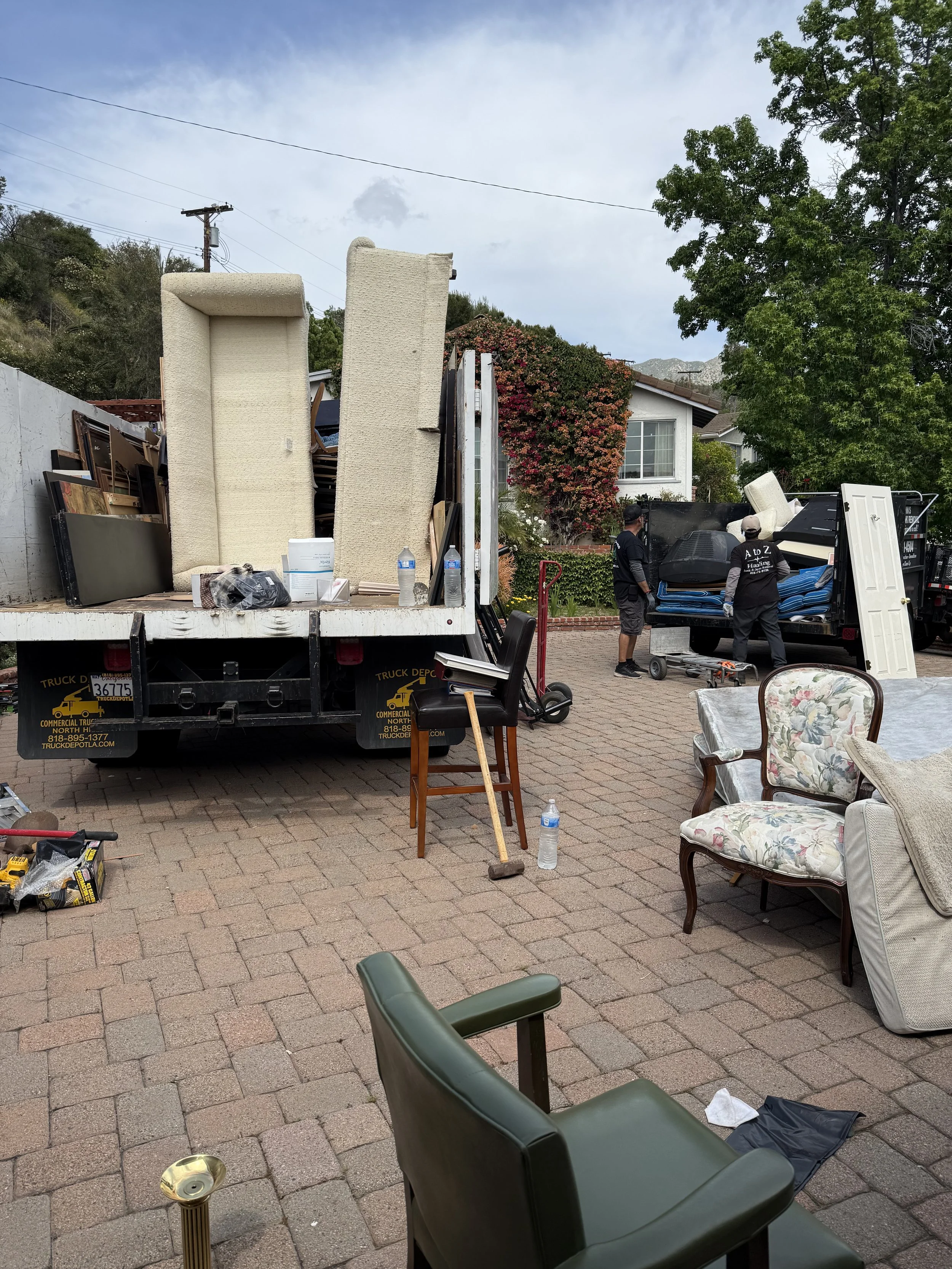 Property cleanout service in Burbank CA with A to Z Hauling Junk Removal removing furniture and household items from a residential home