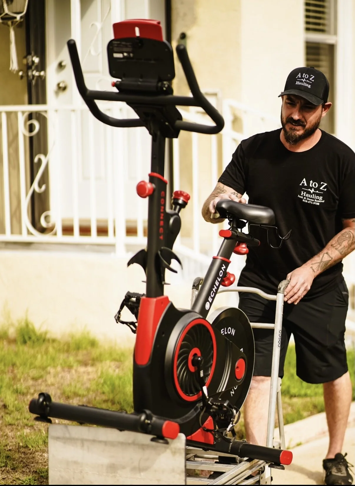 A to Z Hauling crew member removing workout equipment during an apartment cleanout in Burbank, CA