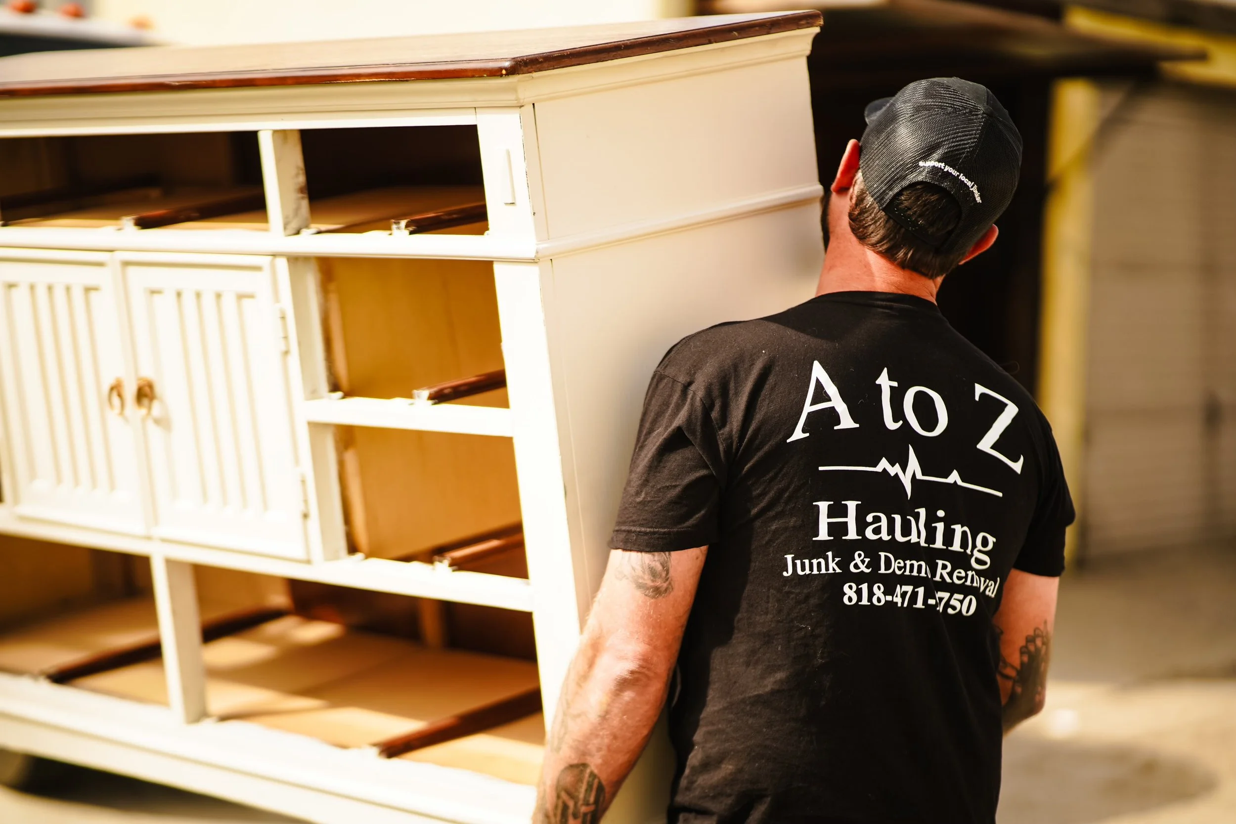 A to Z Hauling Crew member removing furniture 