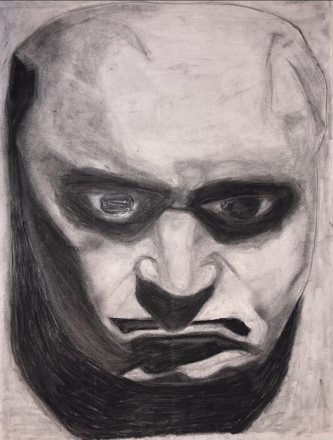 A black and white sketch of a man's face with exaggerated dark shadows and intense expression.
