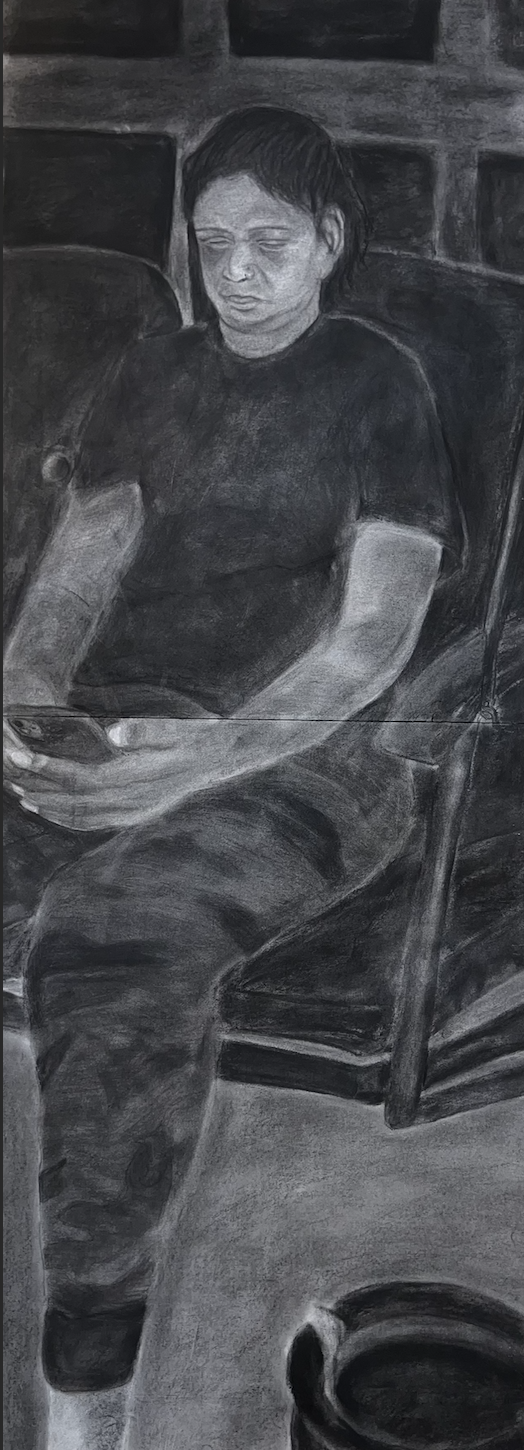 A black and white drawing of a person sitting, with dark hair, wearing a dark t-shirt and camouflage pants, looking down at their phone.