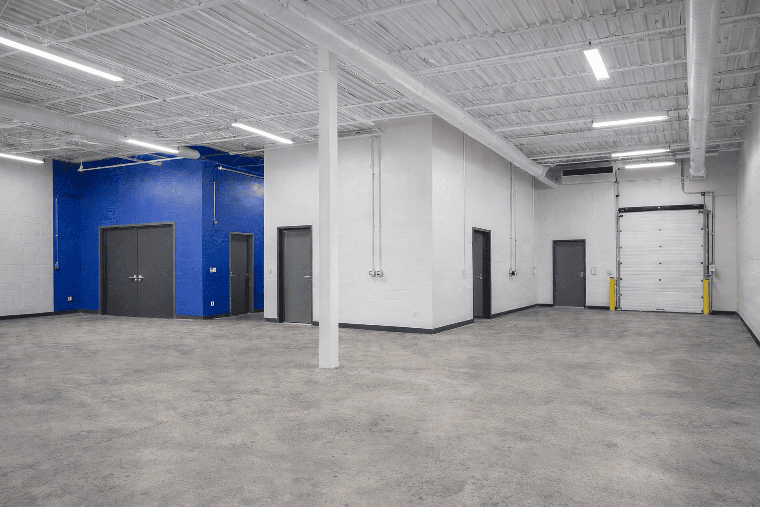 Commercial warehouse interior painting completed by Vita Painting in Macomb, Michigan