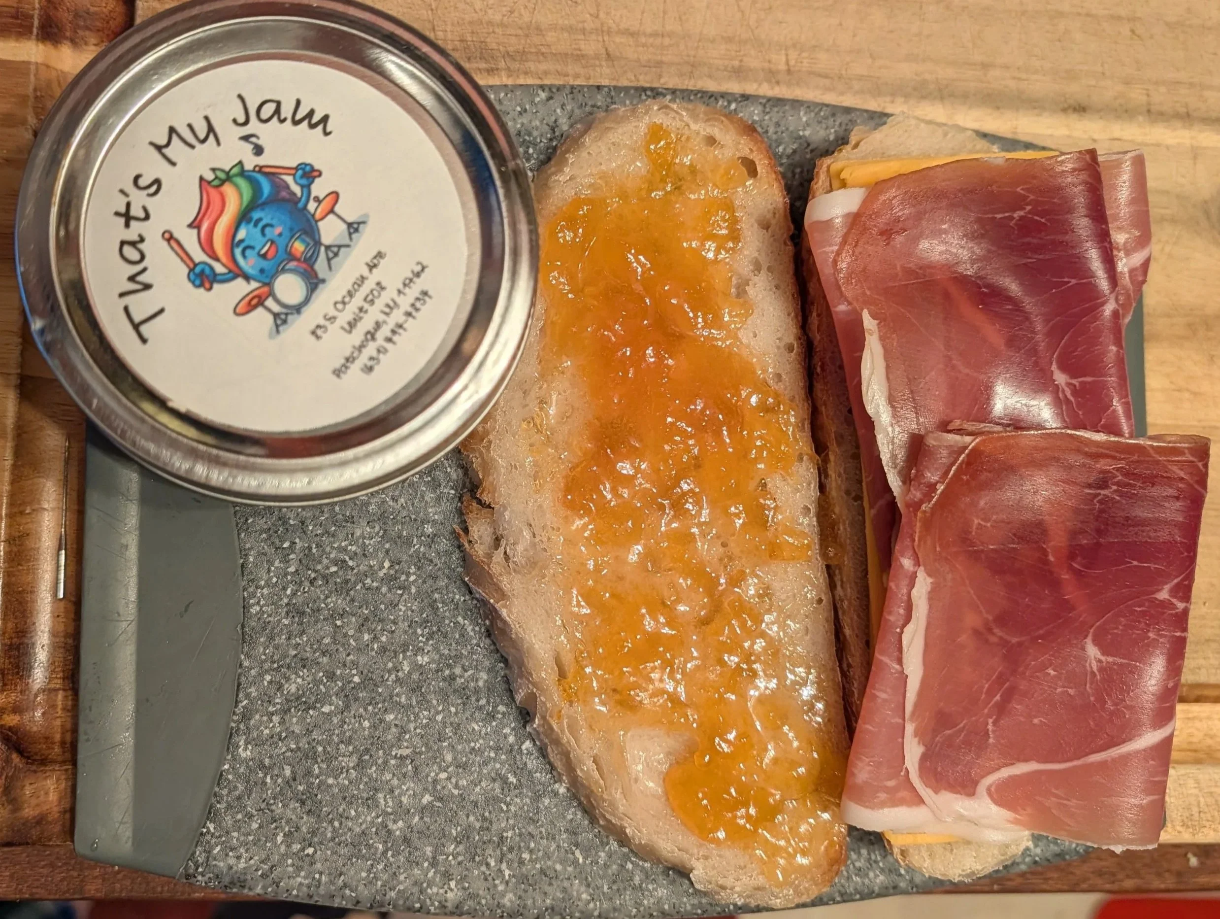 Makings of apricot jam, prosciutto and cheddar grilled cheese.