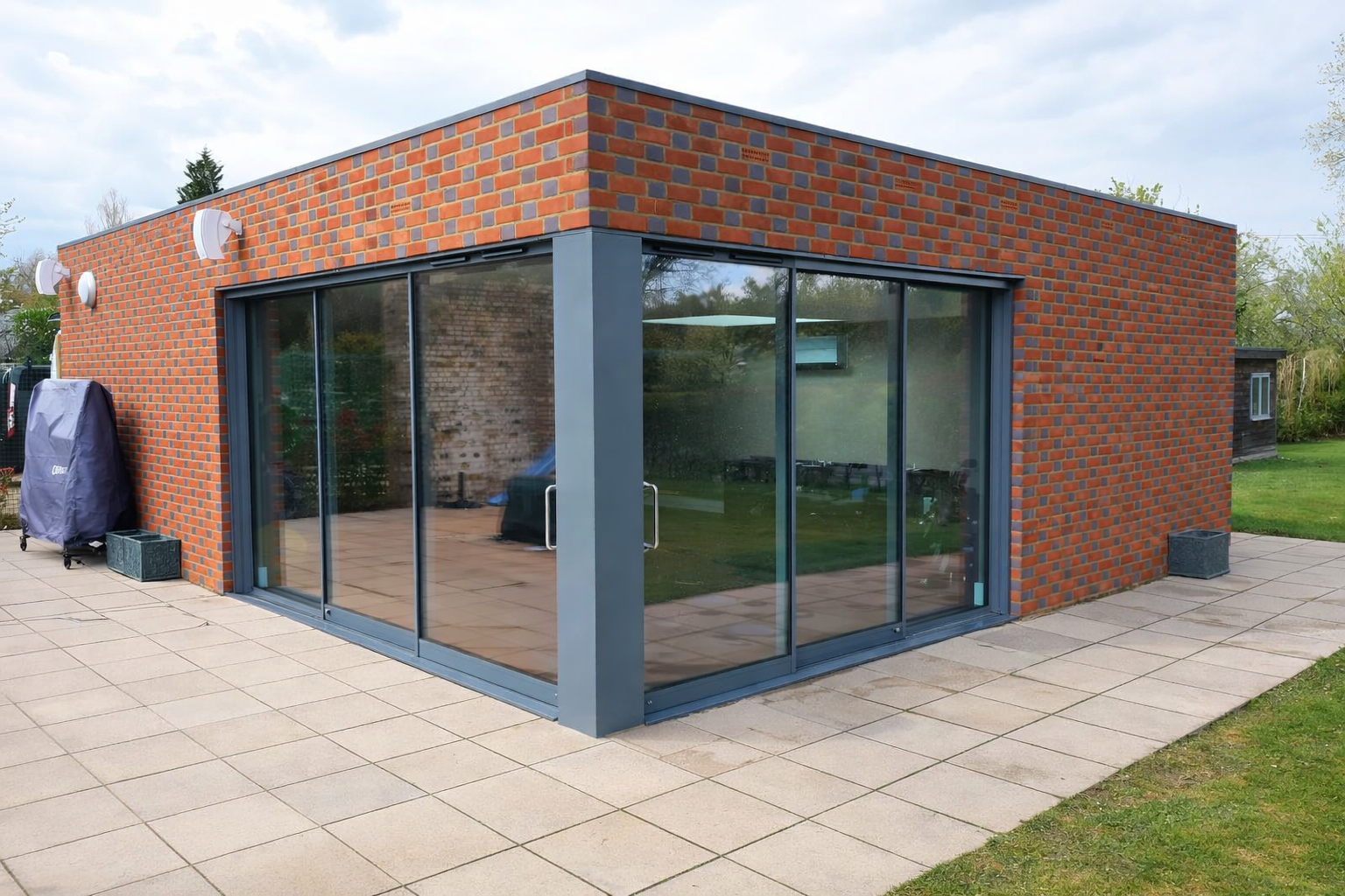 Flemish bond brickwork Large sliding glass doors Piled waffle pod concrete slab