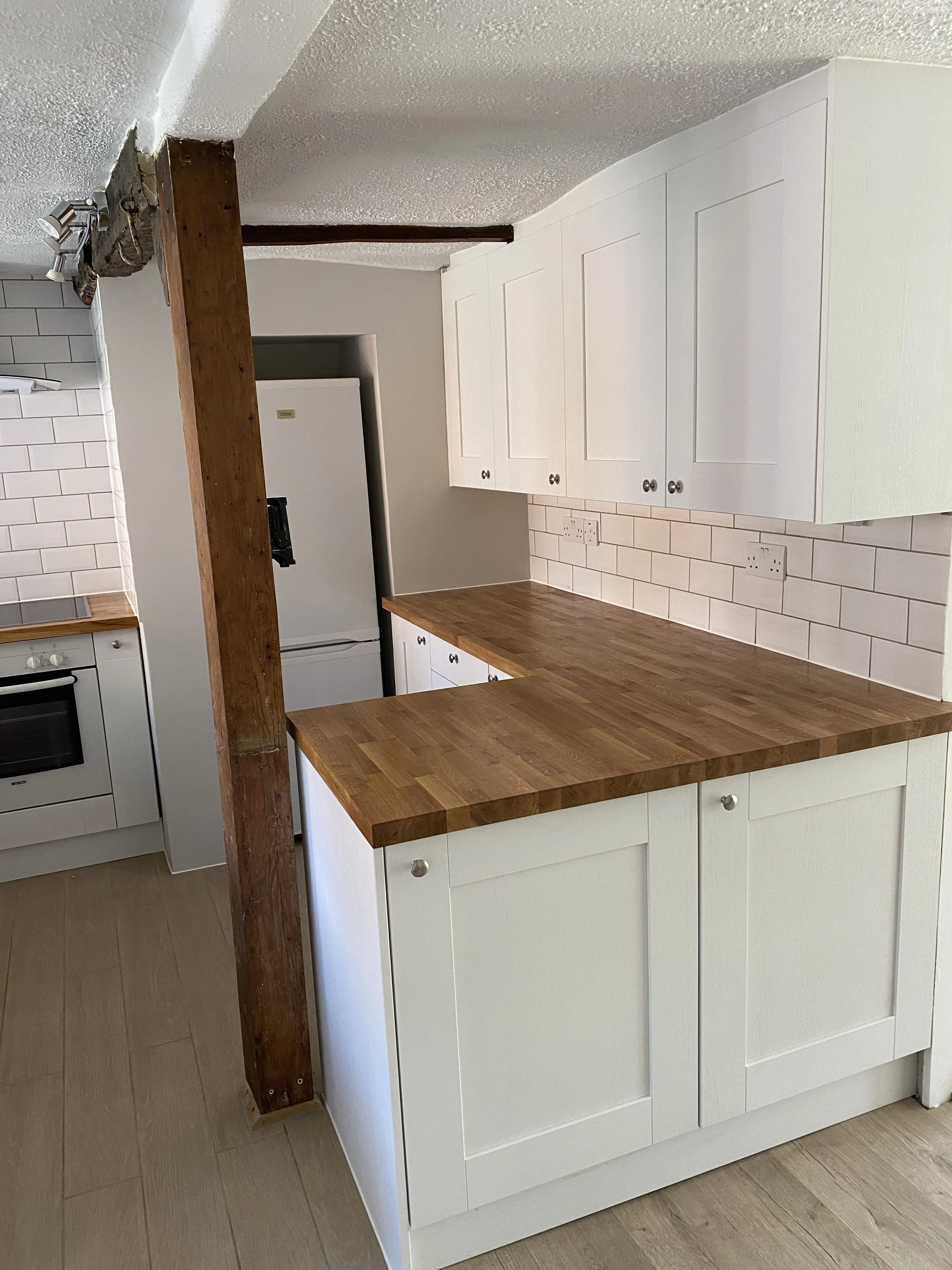 New kitchen worktop installation with upgraded sink, tap and modern finishes.