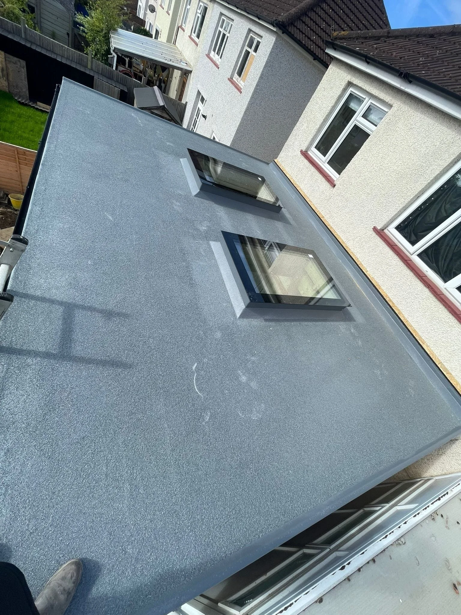GRP flat roof with two rooflights on rear extension in Kingston.
