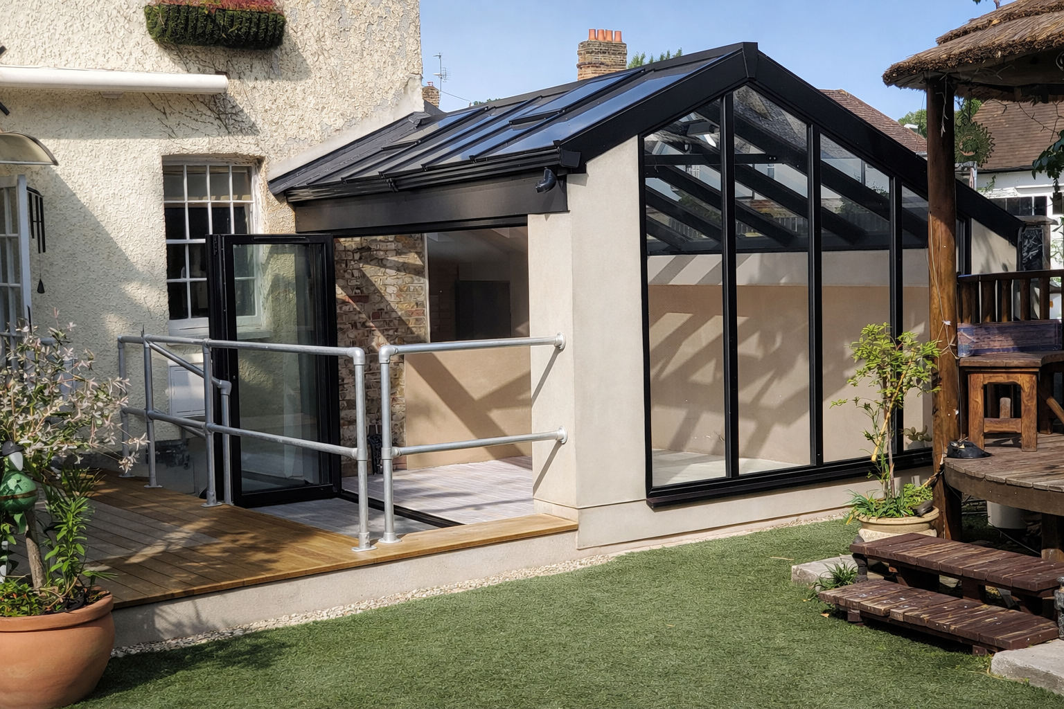 Eco-friendly conservatory extension blending with the home, featuring glazed roof and expansive sliding doors