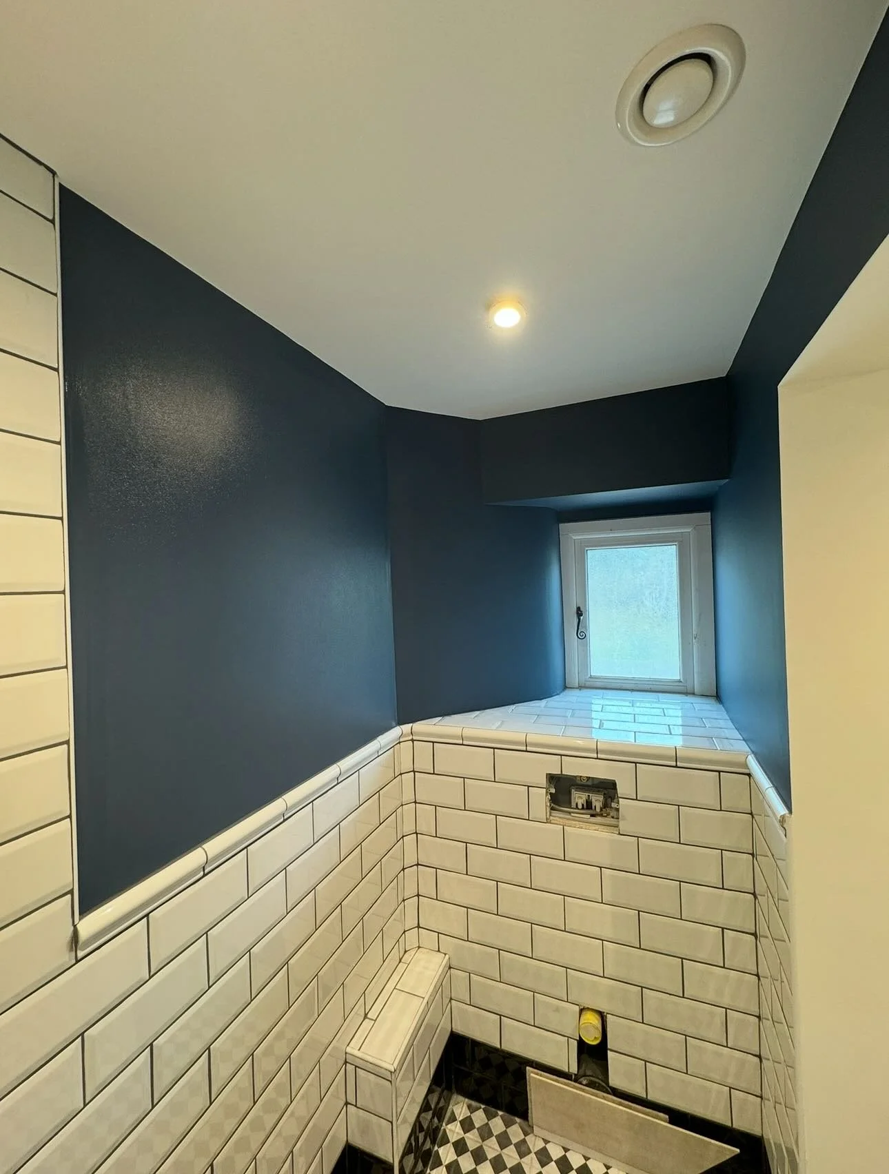 Blue en-suite.. Pops with the white tiles