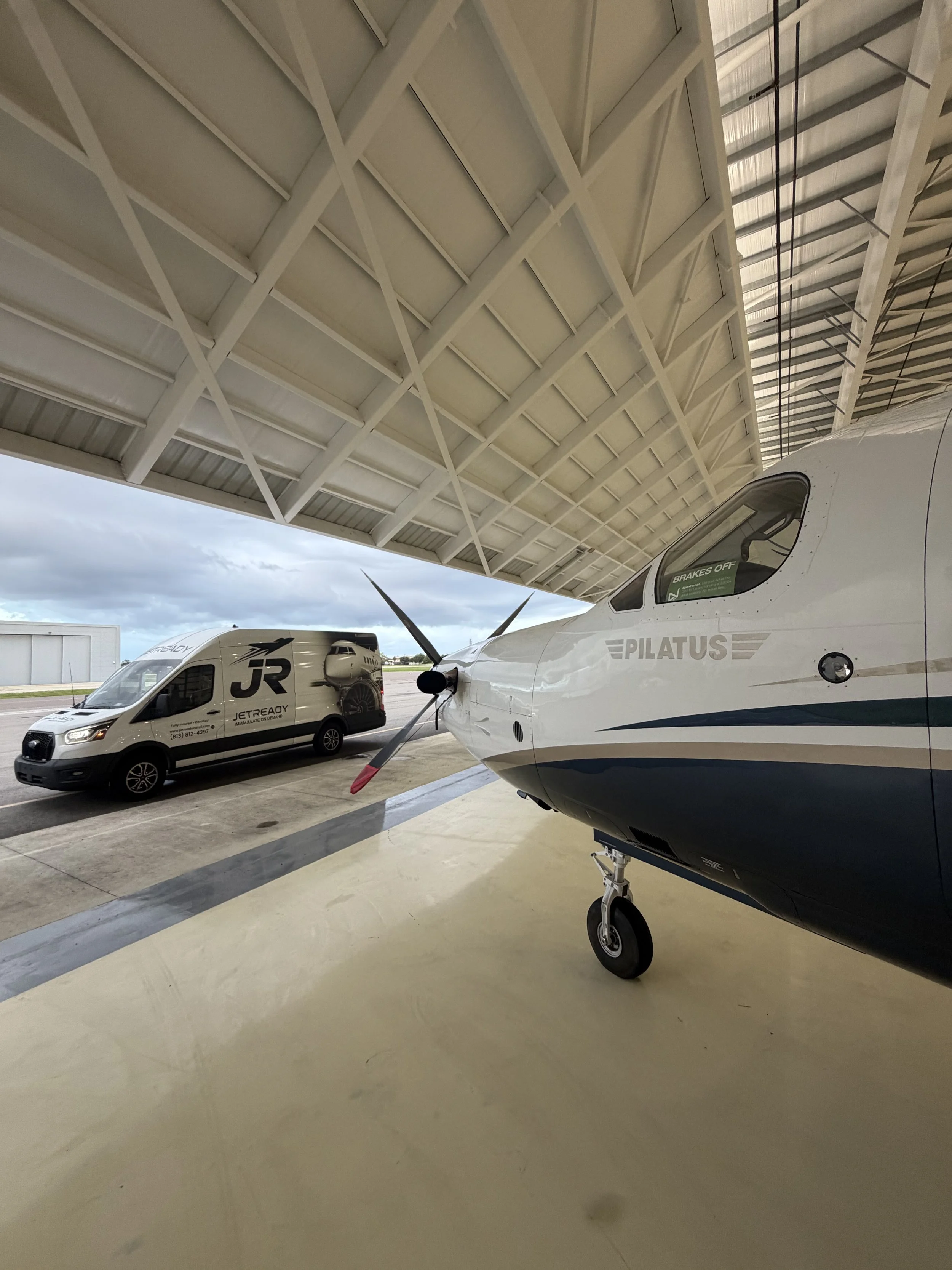 JetReady Detailing mobile aircraft detailing service inside a Florida aviation hangar.