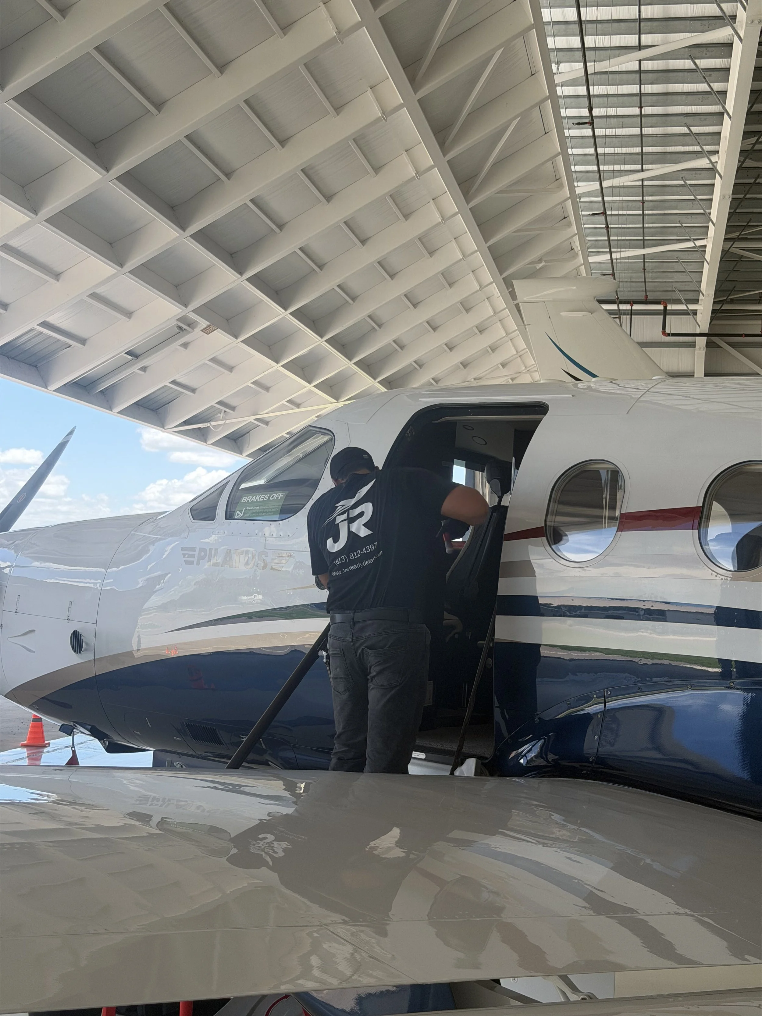JetReady technician performing professional detailing on a private aircraft.