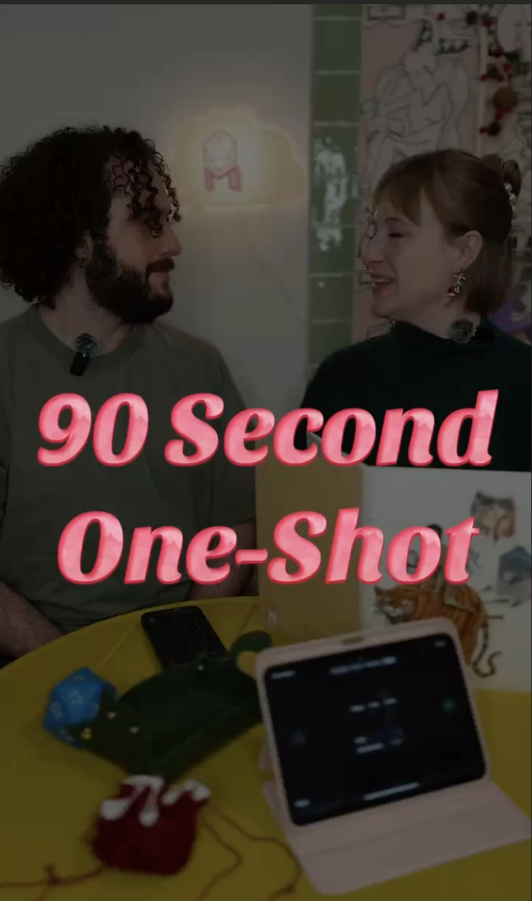 Two people, a man with curly hair and a woman with earrings, are smiling at each other at a table with a yellow tablecloth. The table has a smartphone, game controllers, snacks, and a drink. There is a background with colorful artwork and a logo. The text "90 Second One-Shot" is overlaid in pink.