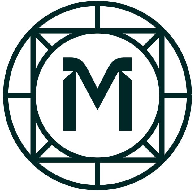 A black circular logo with a large letter M in the center, surrounded by a geometric border.