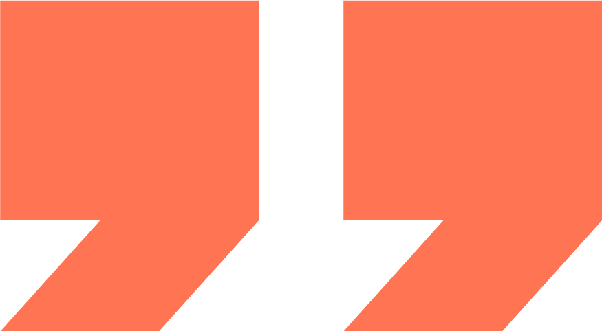 Close-up of a logo with black and dark orange shapes forming a stylized 'U' or letter with geometric design.