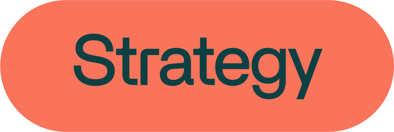 A graphic with the word 'Strategy' in bold black text on an orange rounded rectangle background.
