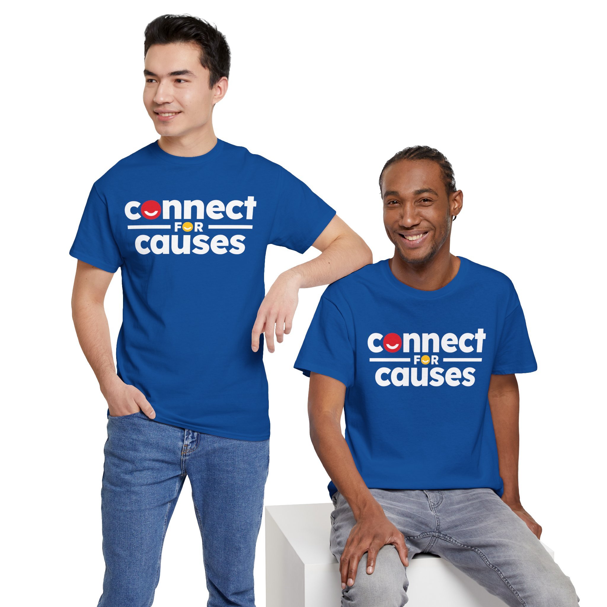Two men wearing blue t-shirts with the logo 'connect for causes' pose against a white background. One man is standing with his hand in his pocket, the other is sitting on a white block, both smiling.