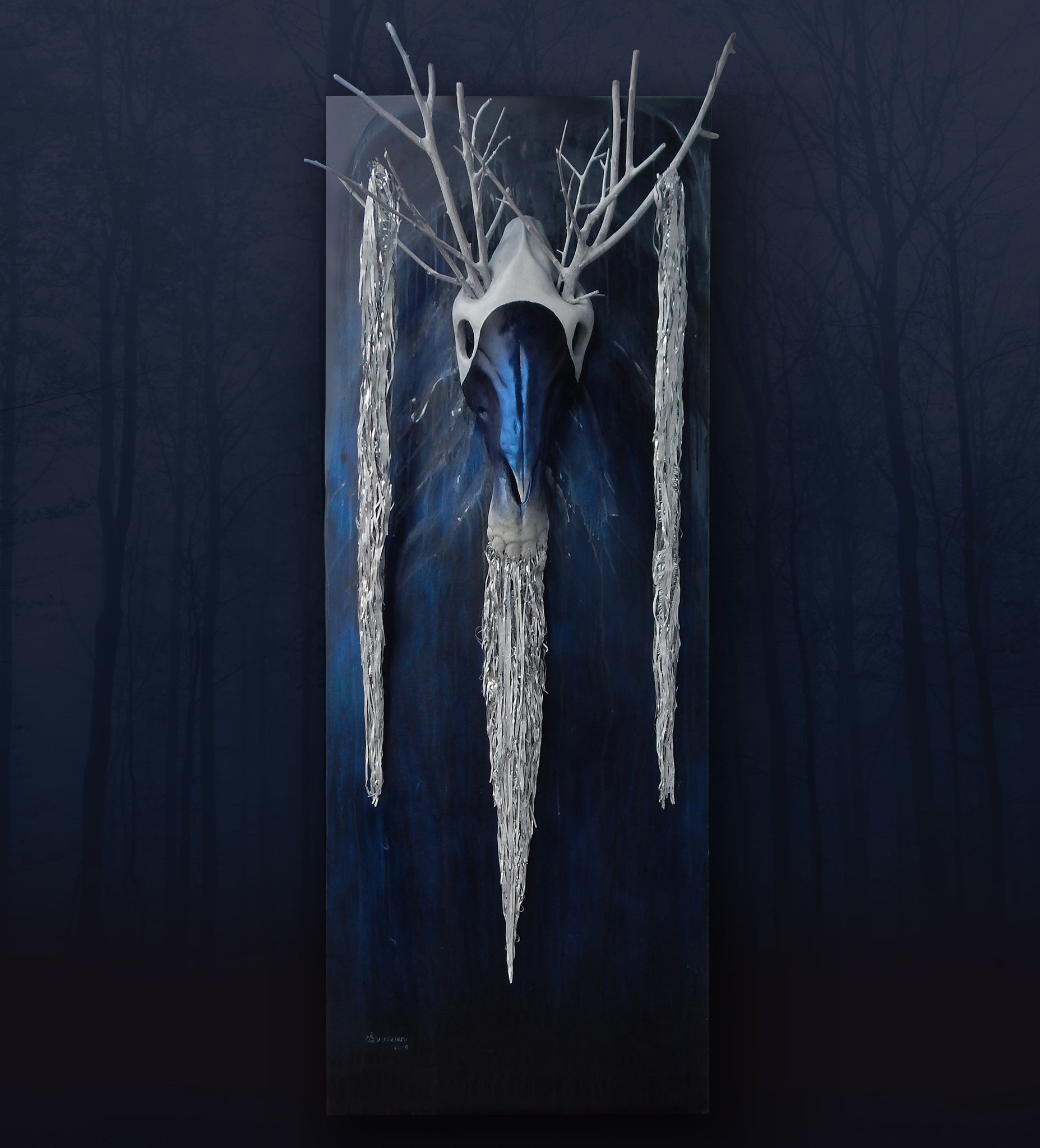 A dark-themed art piece featuring a white animal skull with antlers mounted on a vertical panel. The antlers extend outward and are decorated with elongated, clear, hanging ornament-like elements. The background is dark with subtle forest-like imagery.