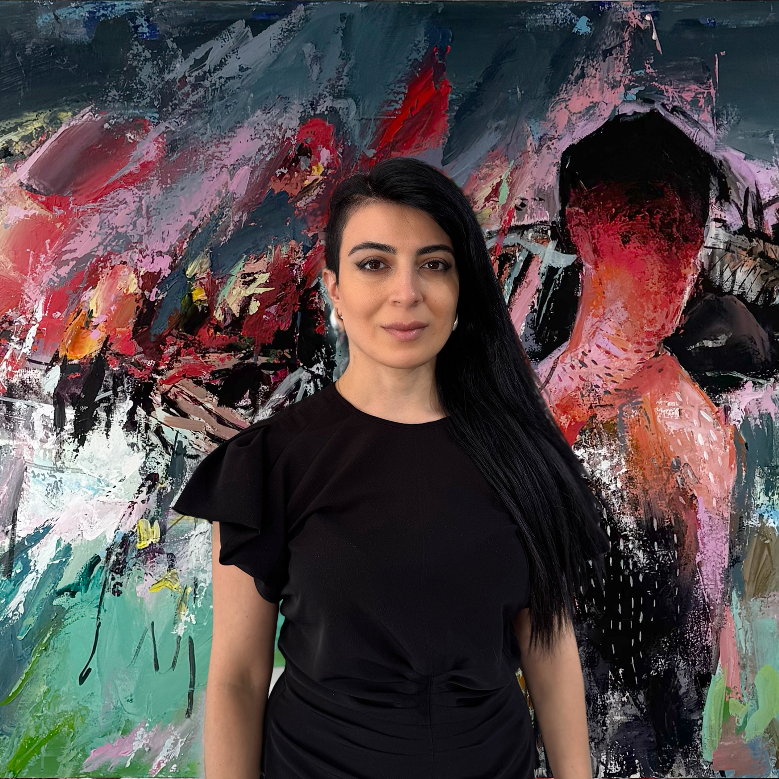 A woman with long black hair wearing a black top standing in front of an abstract colorful painting.