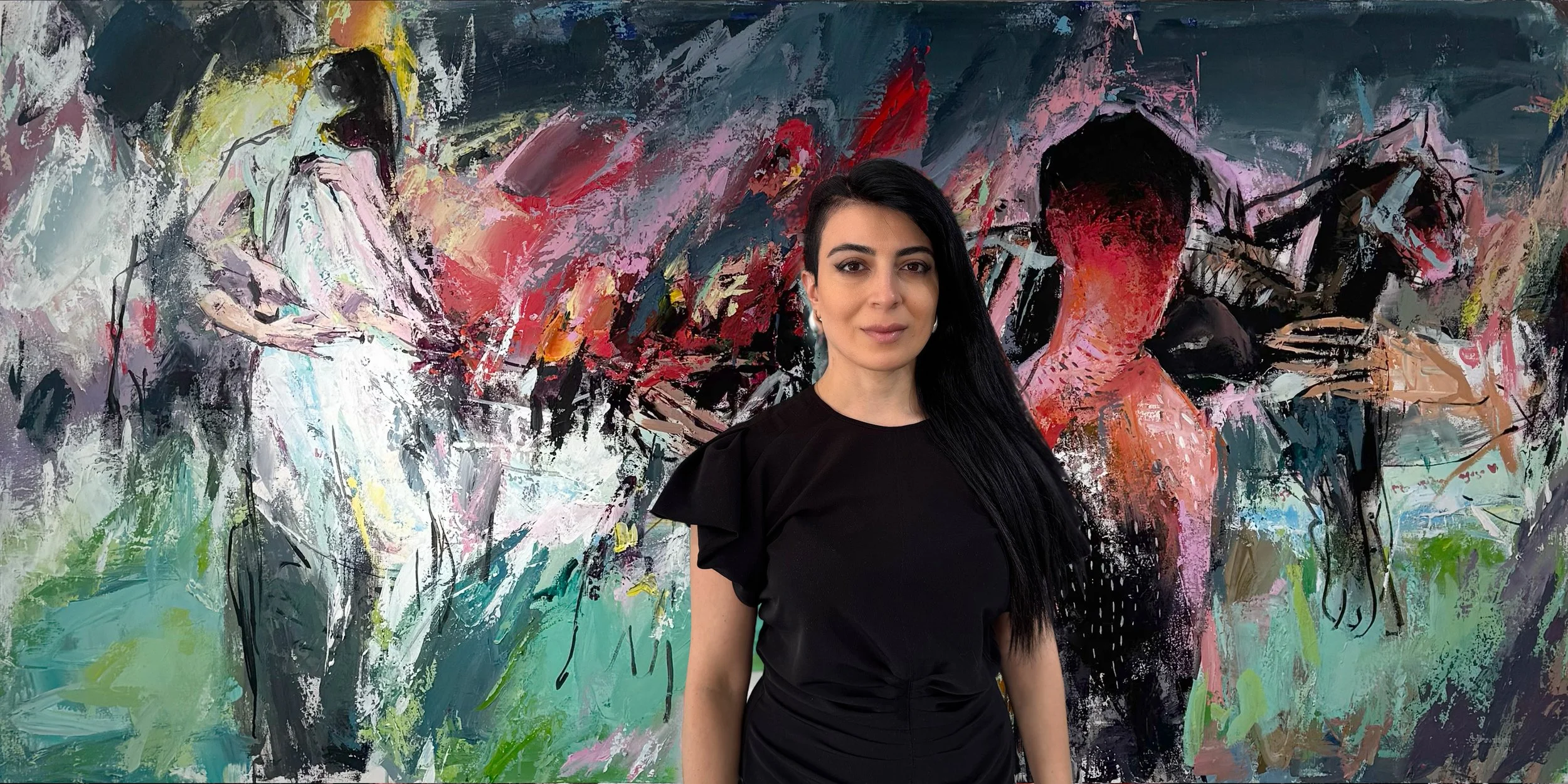 Woman with long black hair wearing a black top standing in front of an abstract colorful mural.
