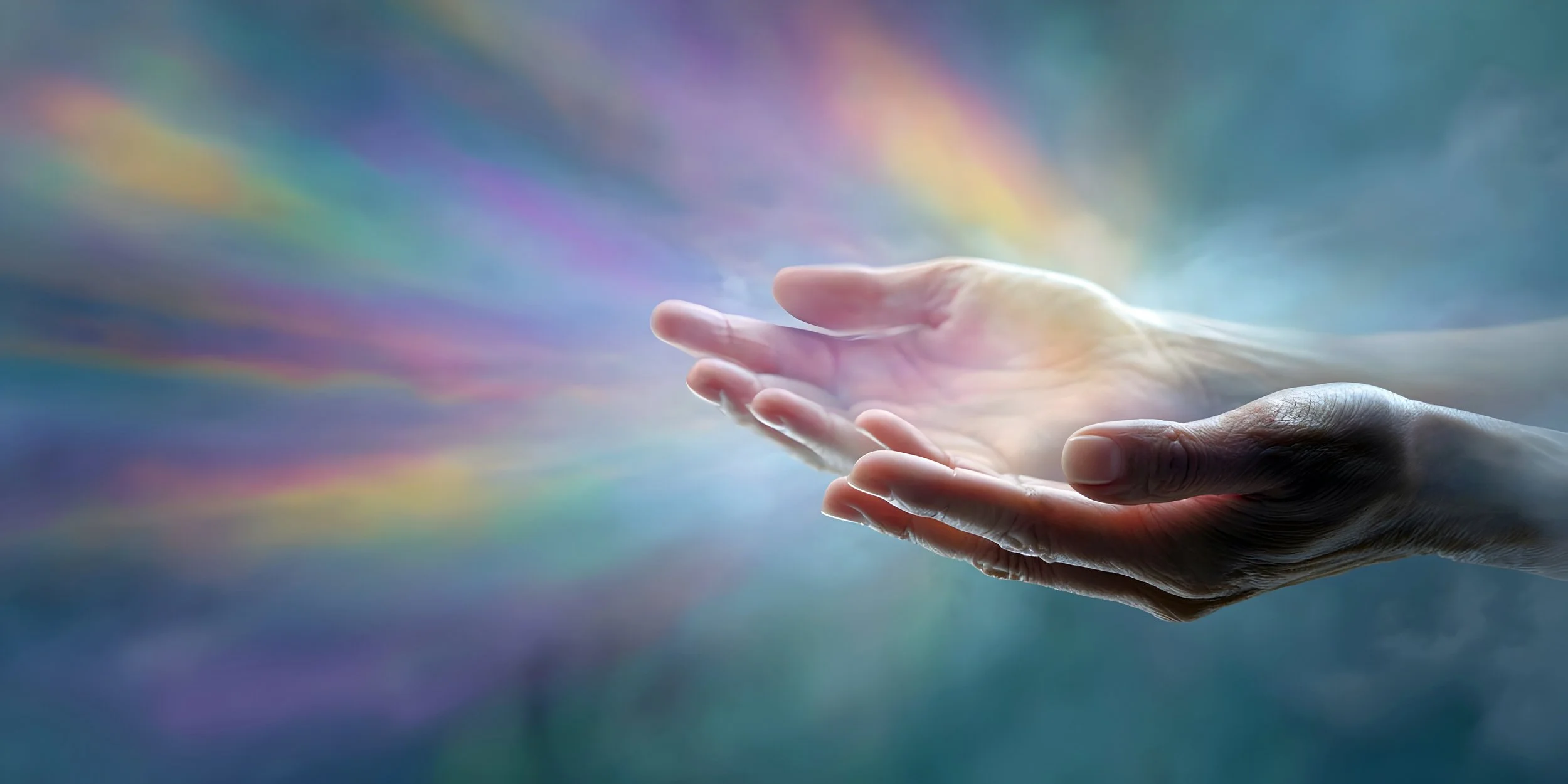 Two hands, one light and the other darker, reaching towards each other against a colorful, abstract background with rainbow hues.
