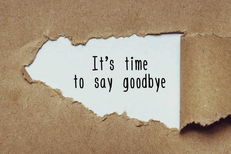Paper with the words “It’s time to say goodbye” representing donation and decluttering pickup services