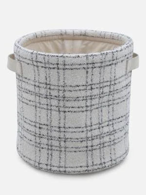 A round fabric storage basket with a plaid pattern in shades of gray and white, featuring two handles on the sides.