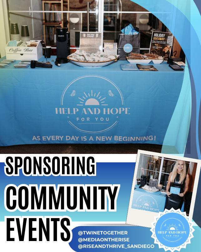 A promotional table for Help and Hope for You at a community event, featuring a blue tablecloth with the organization's logo and slogan, a coffee bar setup, informational materials, and a woman sitting at a secondary table with a tablet.