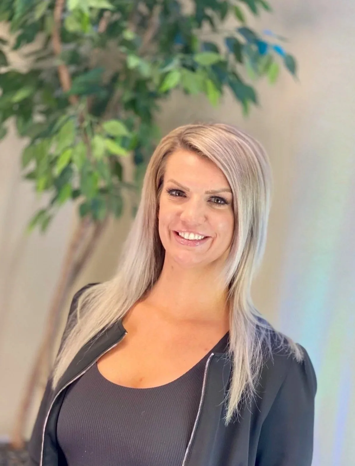 blonde woman smiling towards viewer