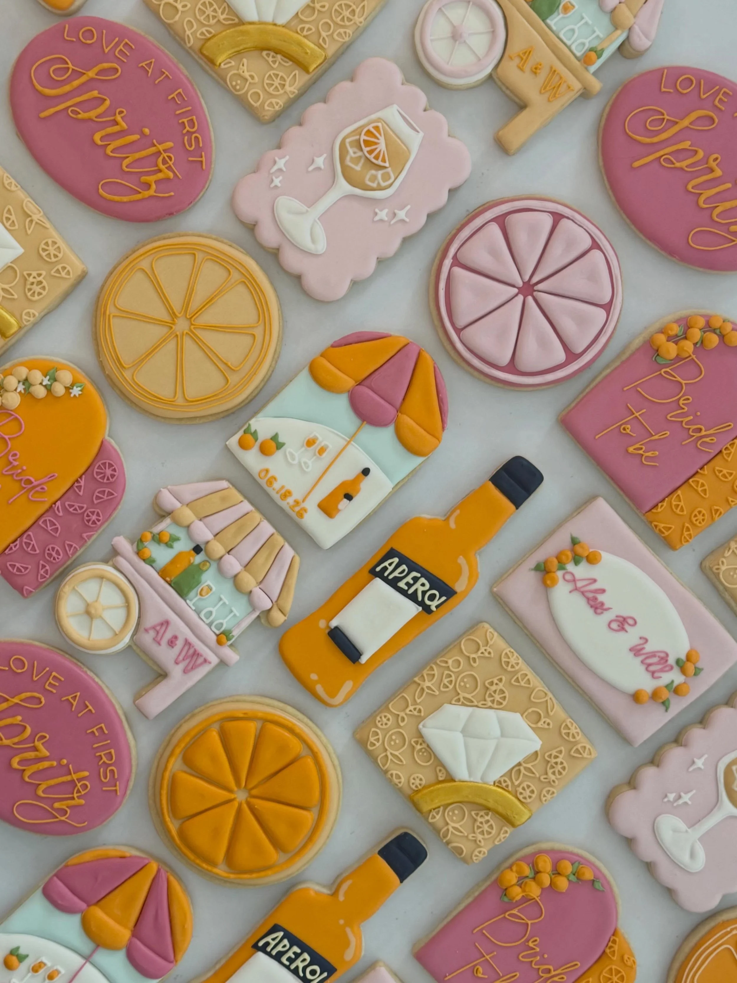 Love at first Spritz 🍊✨

Cheers to Alex &amp; Will! 🥂

#celinatx #aperolspritzcookies #bridalshowercookies #divinedelightsbakery #customsugarcookies