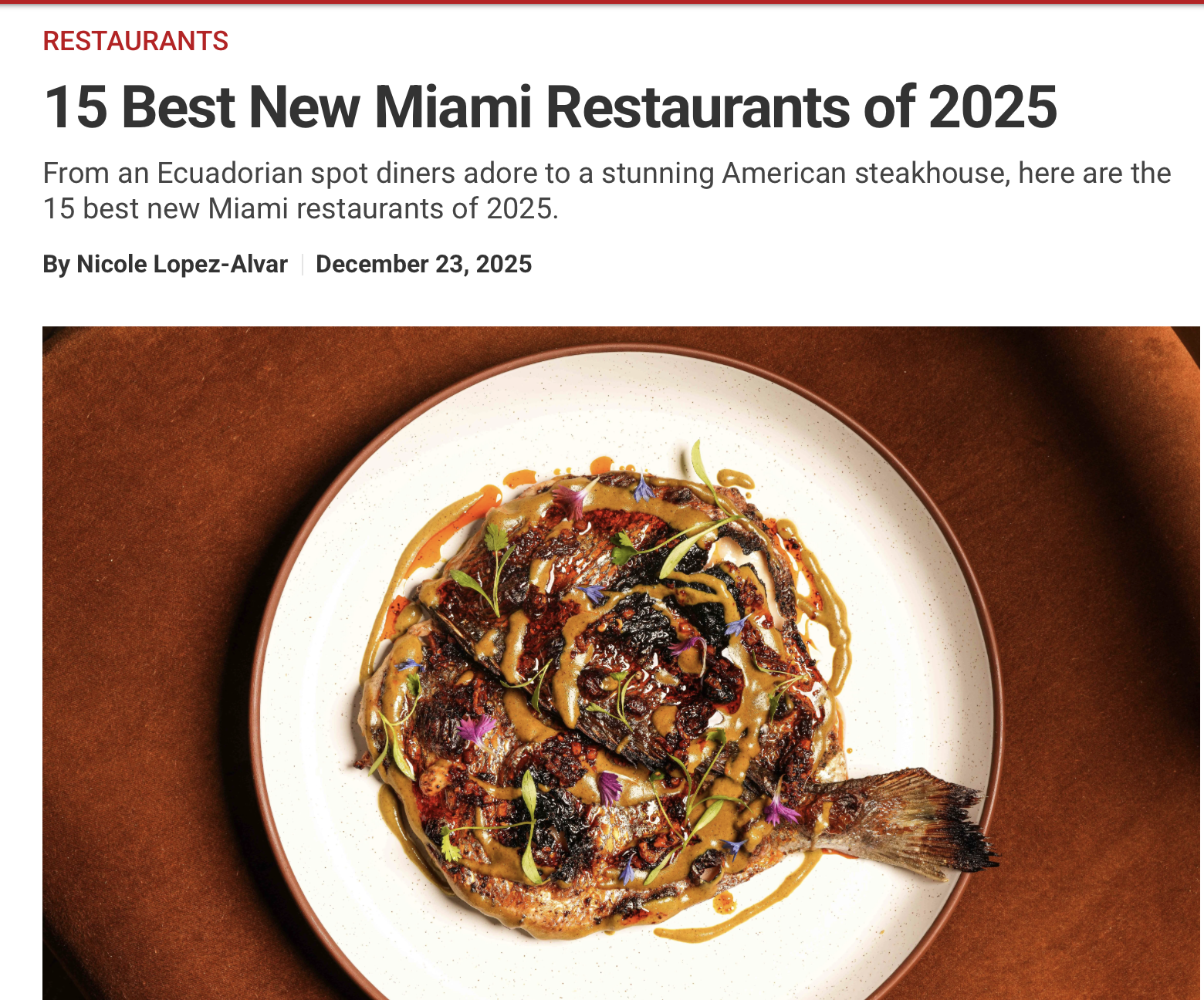 A plated grilled fish garnished with herbs and drizzled with sauces, served on a white round plate with a brown rim.