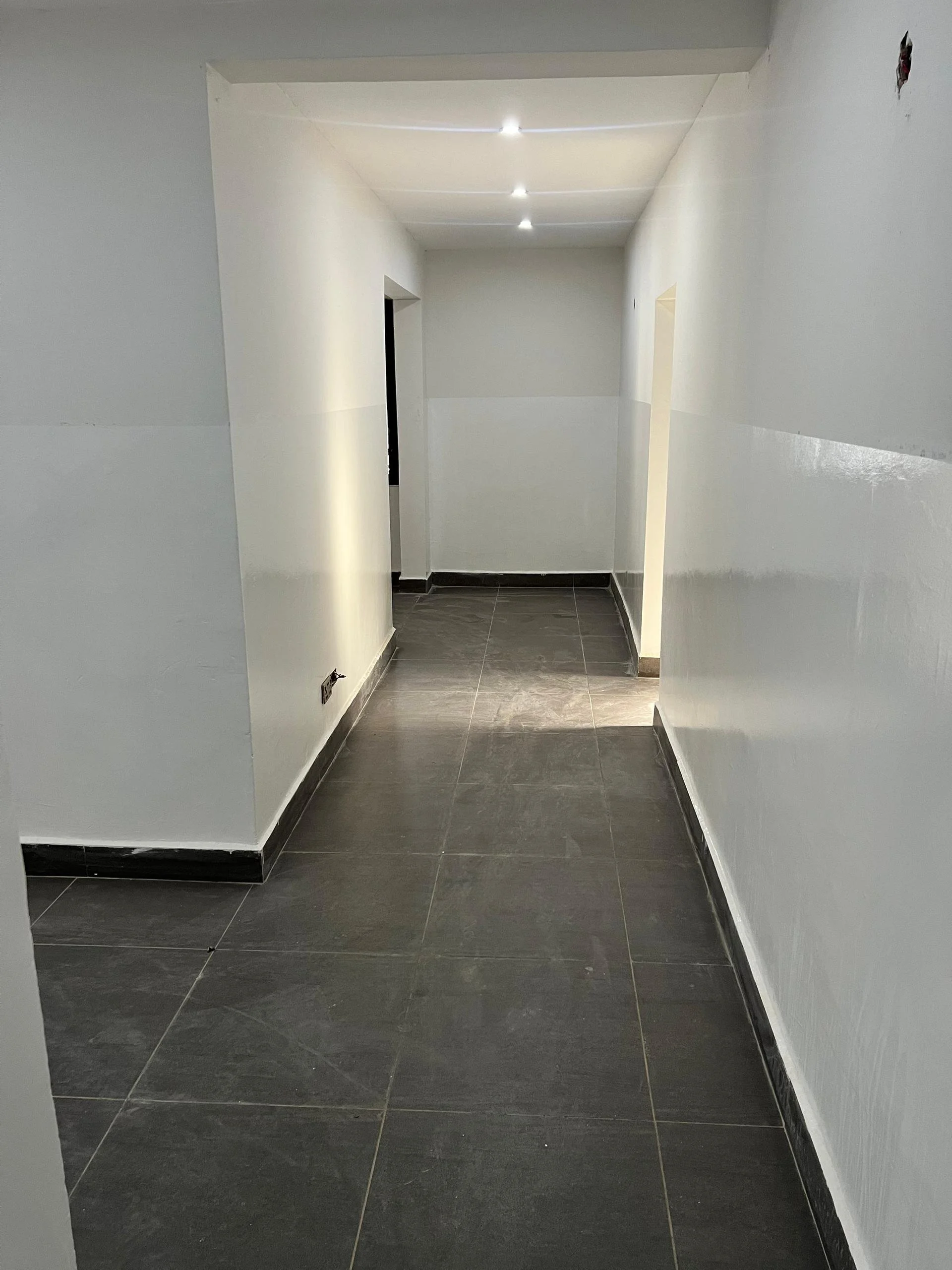 Interior hallway of Sunrise Medical Clinic showing patient access corridors.