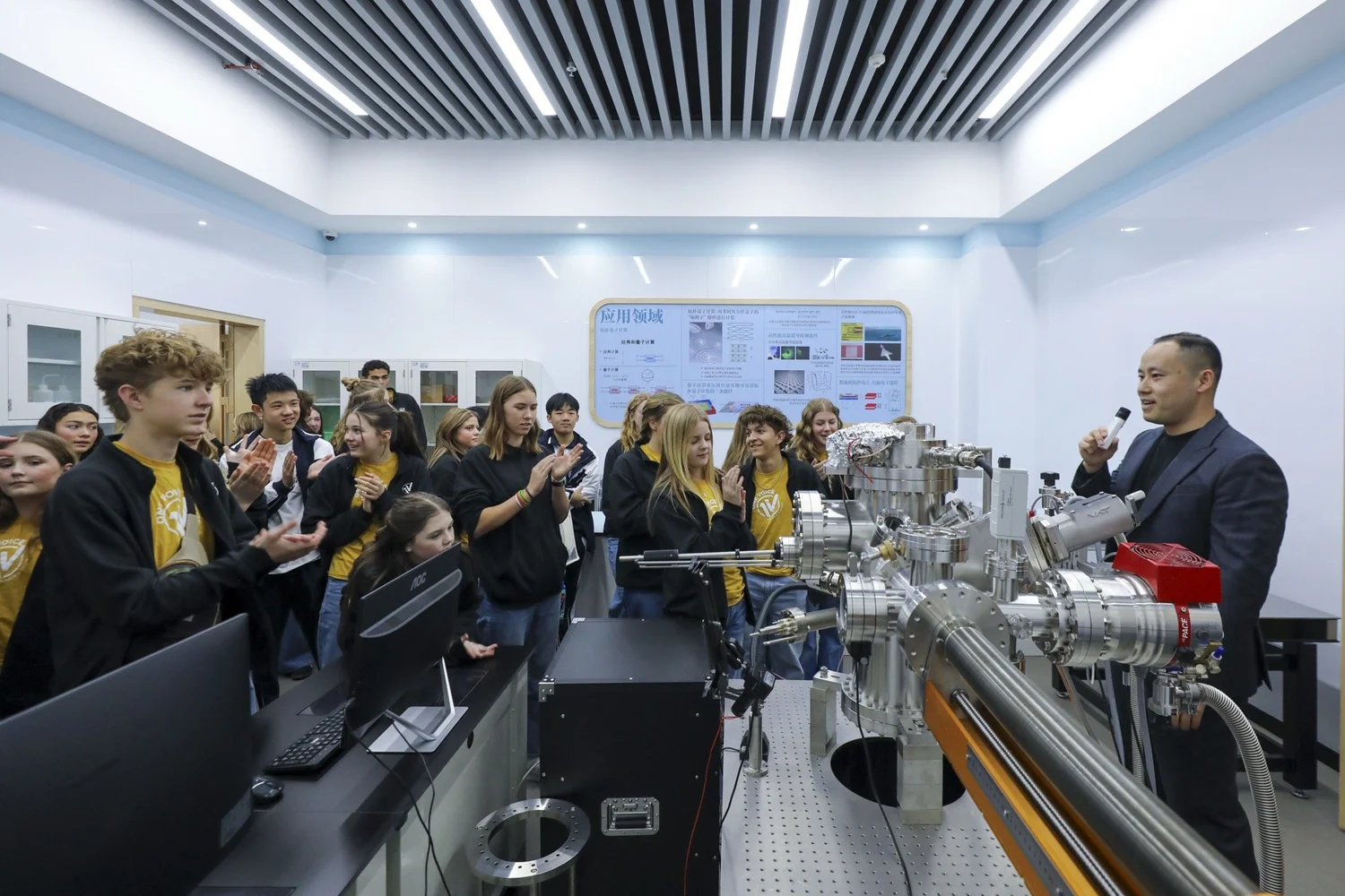 Demonstrating the high-vacuum experimental physics apparatus to choir guests.