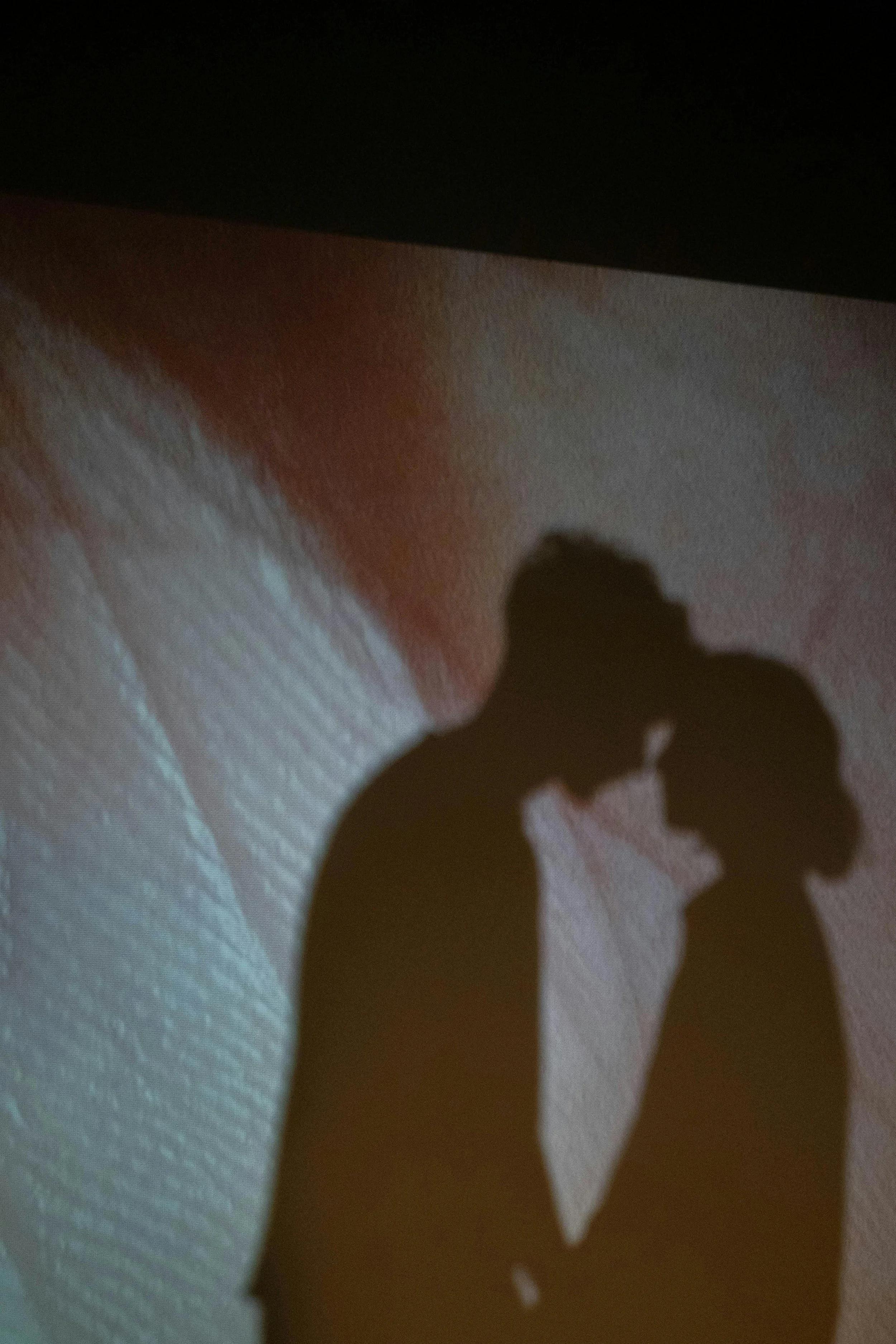 Shadow of couple forehead touching