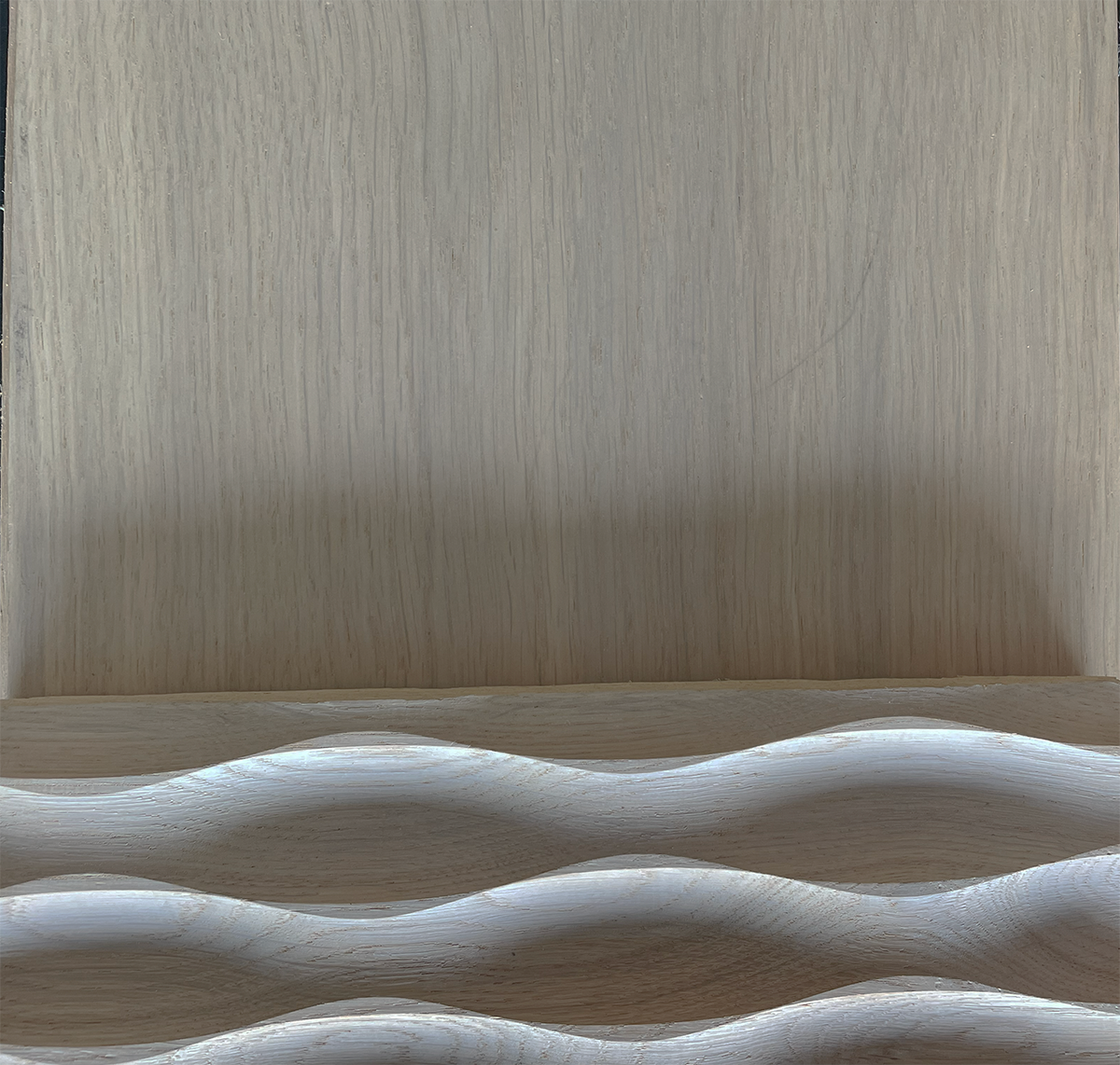 This material image shows how closely our local craftsman was able to match the textured ceiling panels to the wood flooring.